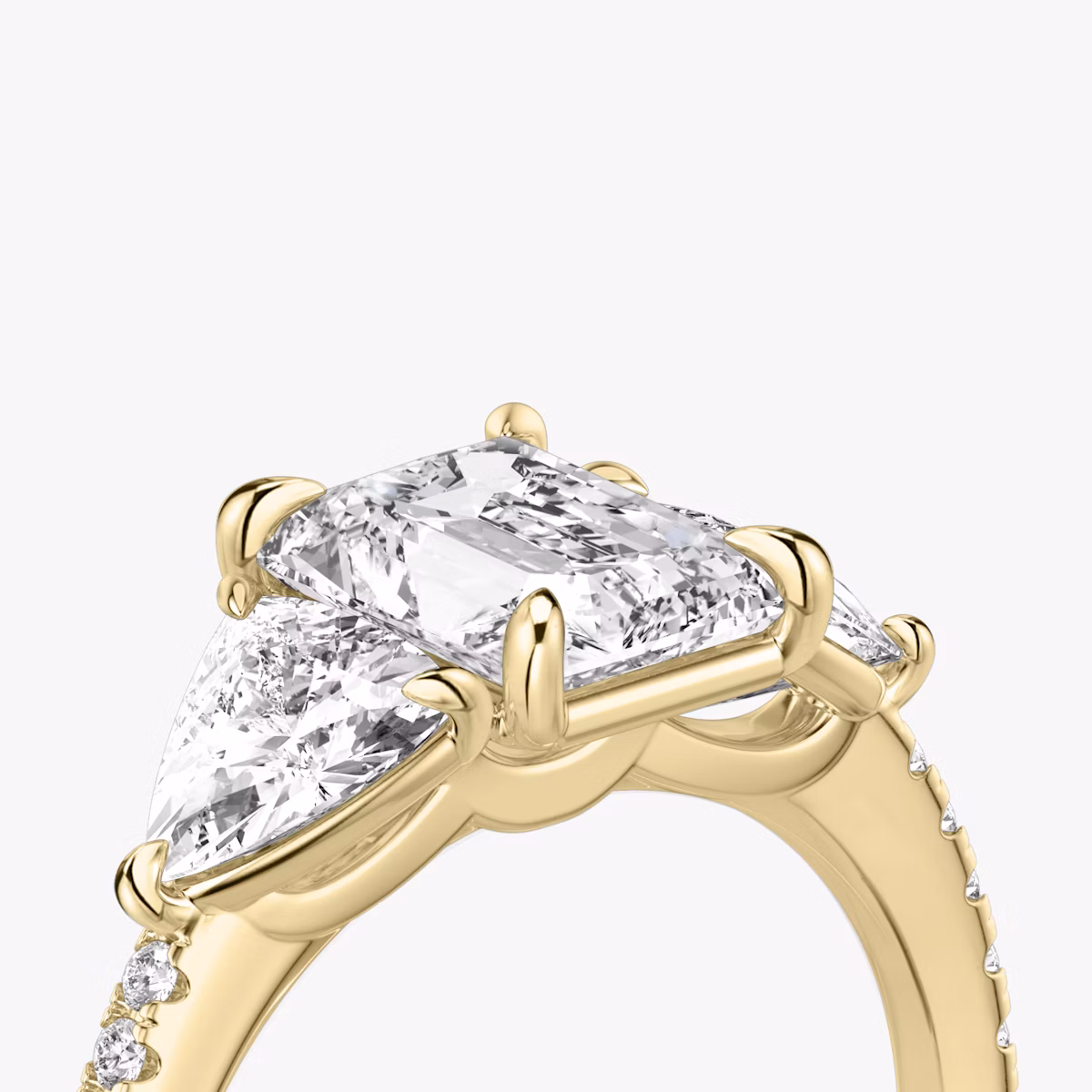 The Three Stone | Radiant | 18k | Yellow Gold | bandAccent: Pavé | sideStoneCarat: 0.50ct | sideStoneShape: Trillion | diamondOrientation: vertical | caratWeight: other