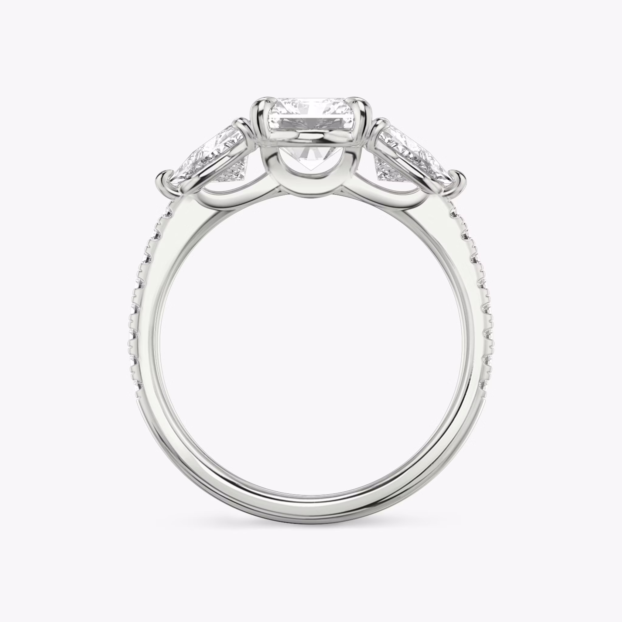 The Three Stone | Radiant | 18k | White Gold | bandAccent: Pavé | sideStoneCarat: 0.50ct | sideStoneShape: Trillion | diamondOrientation: vertical | caratWeight: other