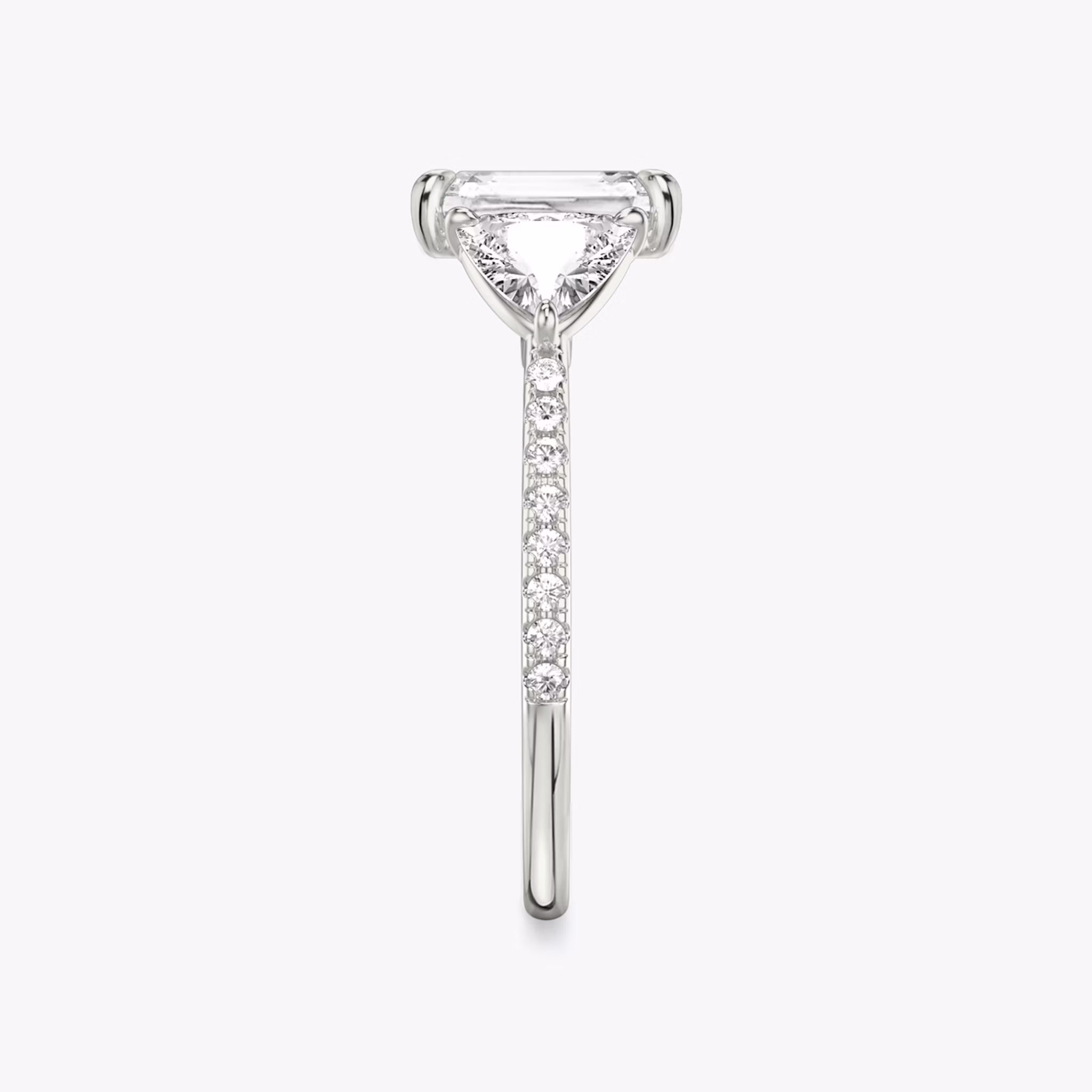 The Three Stone | Radiant | 18k | White Gold | bandAccent: Pavé | sideStoneCarat: 0.50ct | sideStoneShape: Trillion | diamondOrientation: vertical | caratWeight: other
