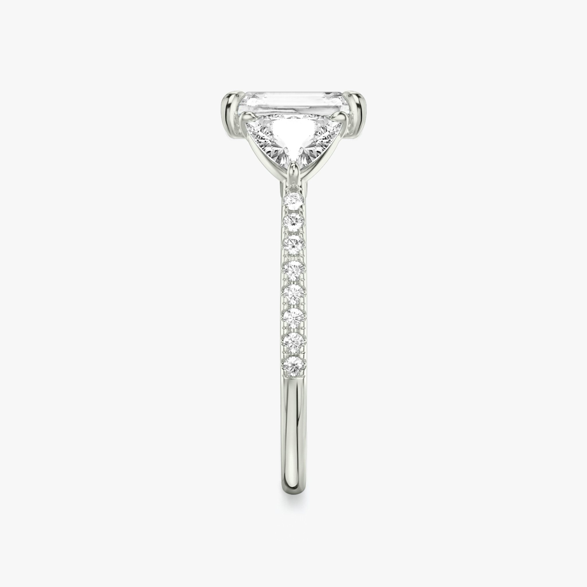The Three Stone | Radiant | 18k | White Gold | bandAccent: Pavé | sideStoneCarat: 0.50ct | sideStoneShape: Trillion | diamondOrientation: vertical | caratWeight: other