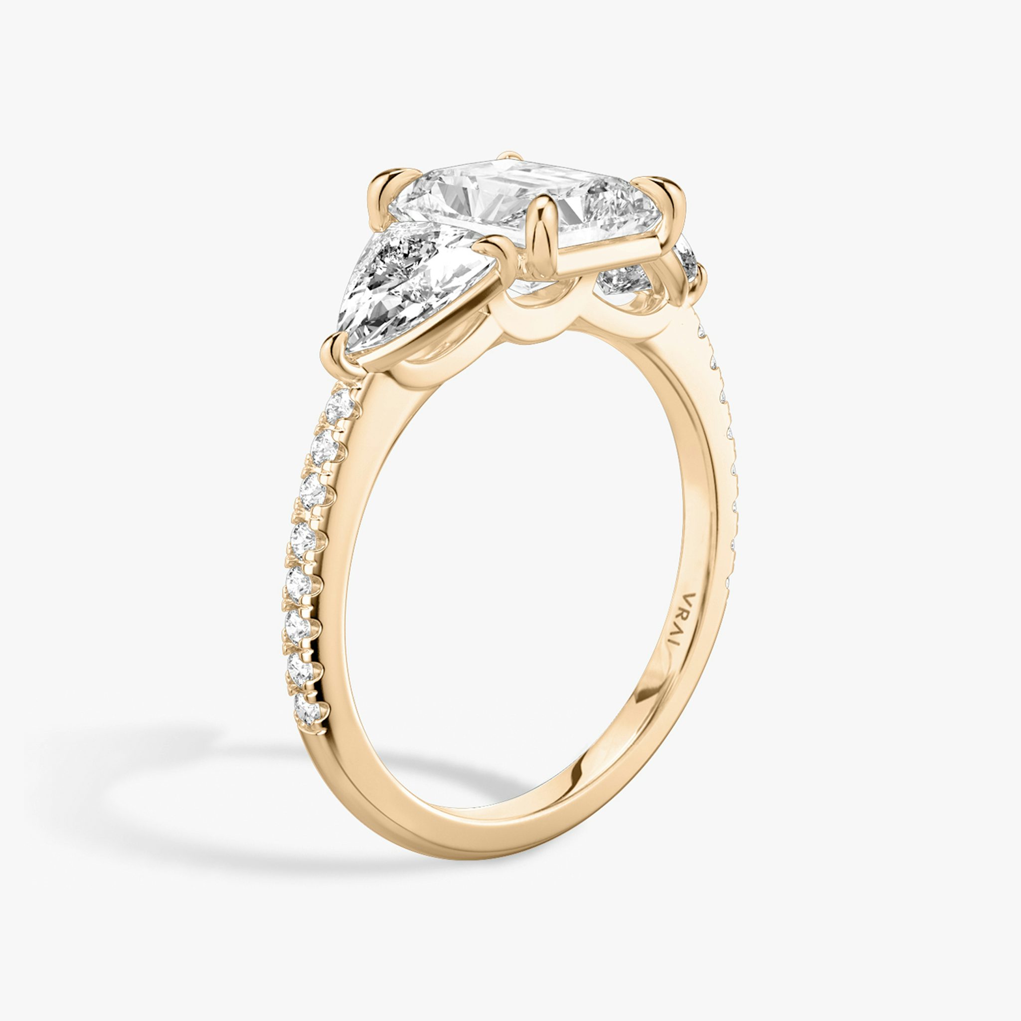 The Three Stone | Radiant | 14k | Rose Gold | bandAccent: Pavé | sideStoneCarat: 0.50ct | sideStoneShape: Trillion | diamondOrientation: vertical | caratWeight: other