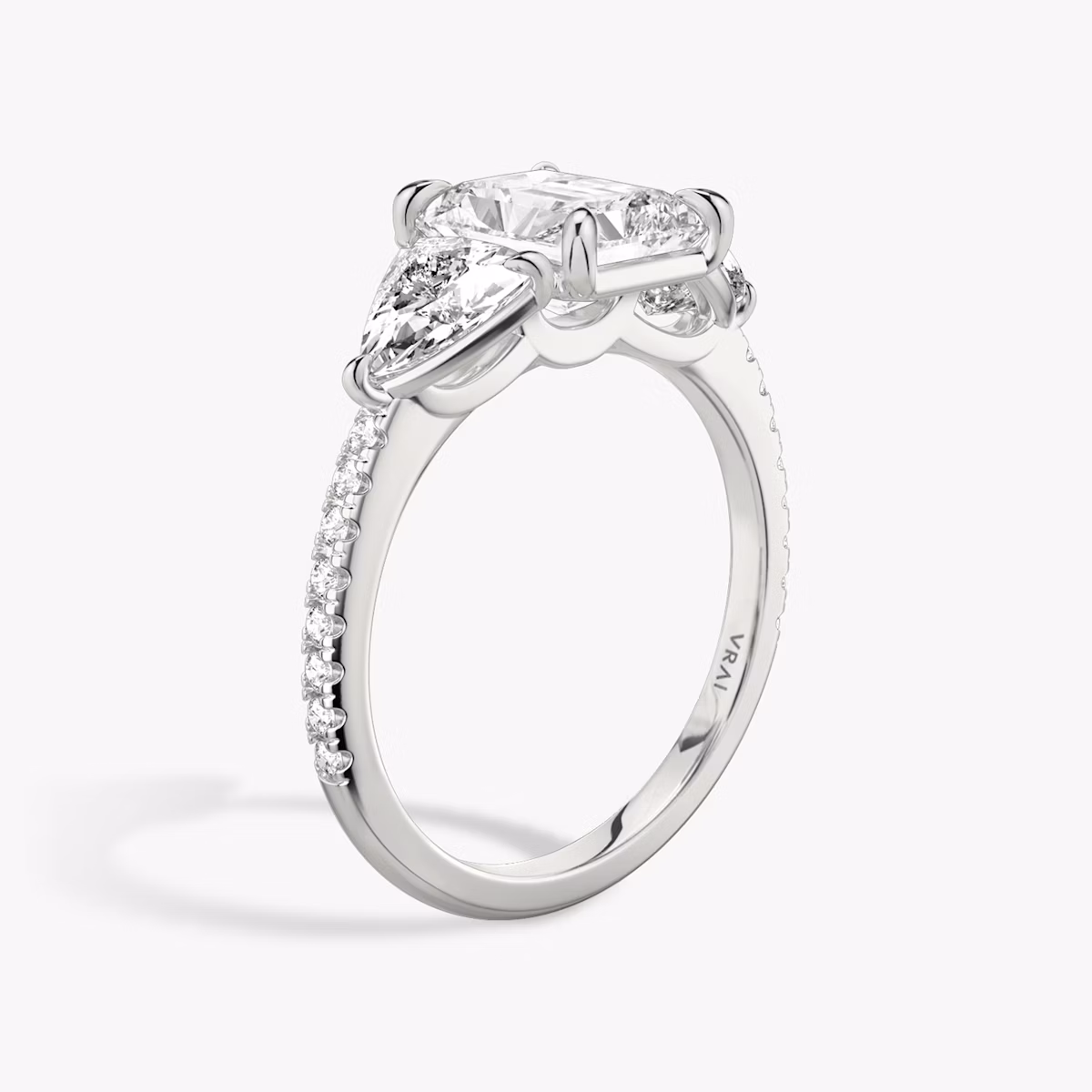 The Three Stone | Radiant | Platinum | bandAccent: Pavé | sideStoneCarat: 0.50ct | sideStoneShape: Trillion | diamondOrientation: vertical | caratWeight: other