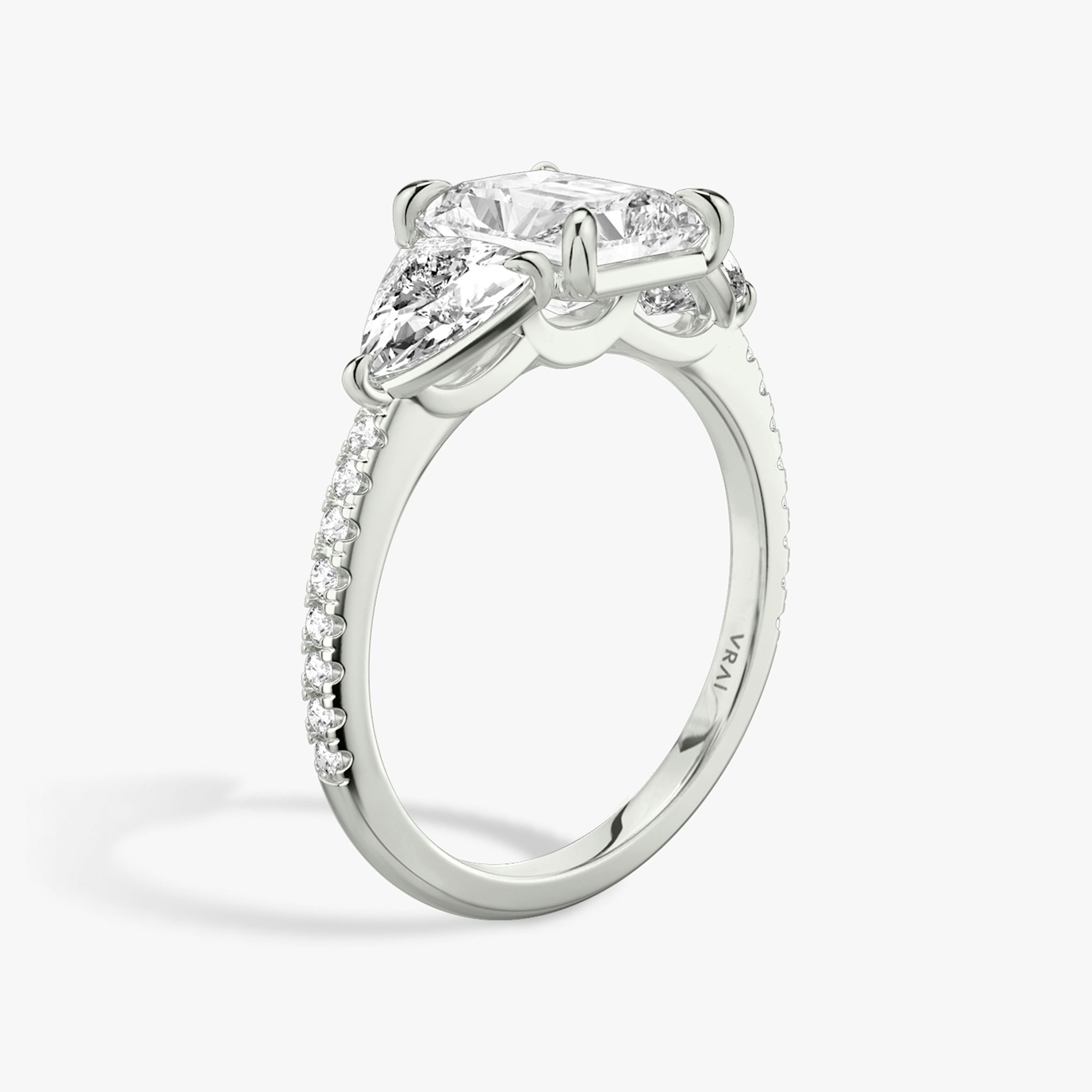 The Three Stone | Radiant | 18k | White Gold | bandAccent: Pavé | sideStoneCarat: 0.50ct | sideStoneShape: Trillion | diamondOrientation: vertical | caratWeight: other