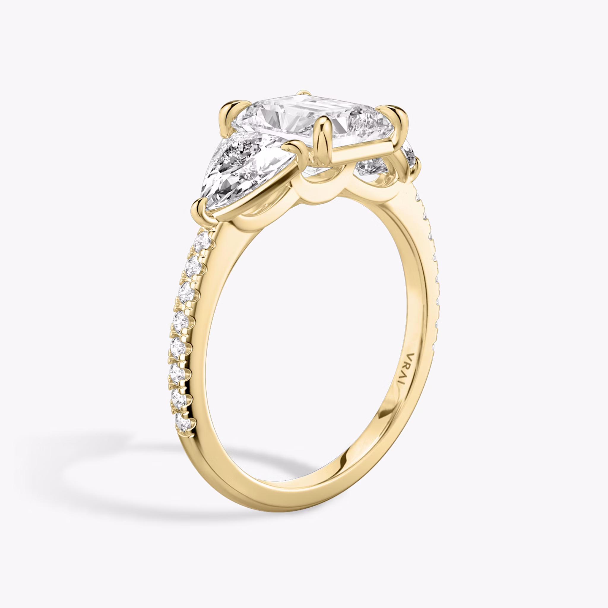 The Three Stone | Radiant | 18k | Yellow Gold | bandAccent: Pavé | sideStoneCarat: 0.50ct | sideStoneShape: Trillion | diamondOrientation: vertical | caratWeight: other