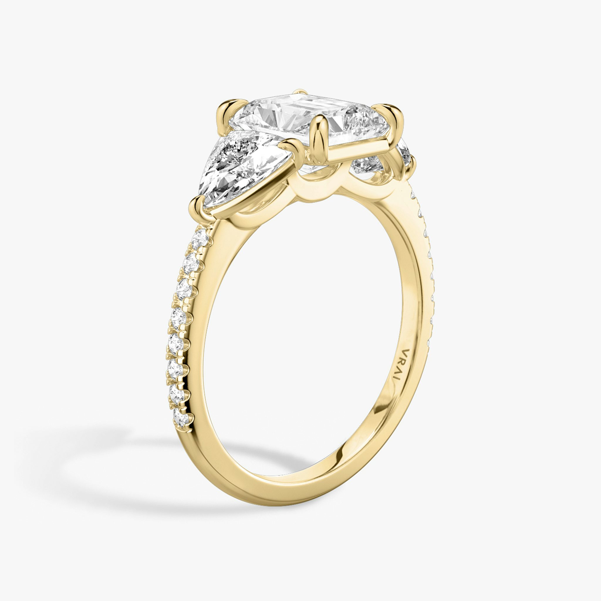 The Three Stone | Radiant | 18k | Yellow Gold | bandAccent: Pavé | sideStoneCarat: 0.50ct | sideStoneShape: Trillion | diamondOrientation: vertical | caratWeight: other