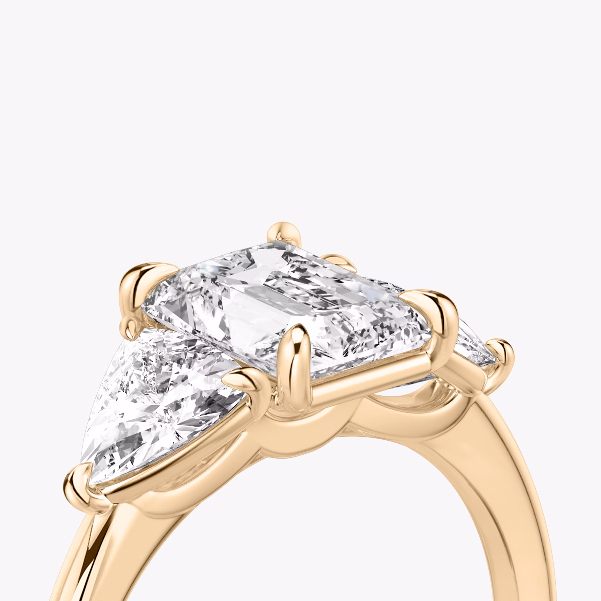 The Three Stone | Radiant | 14k | Rose Gold | bandAccent: Plain | sideStoneCarat: 0.50ct | sideStoneShape: Trillion | diamondOrientation: vertical | caratWeight: other