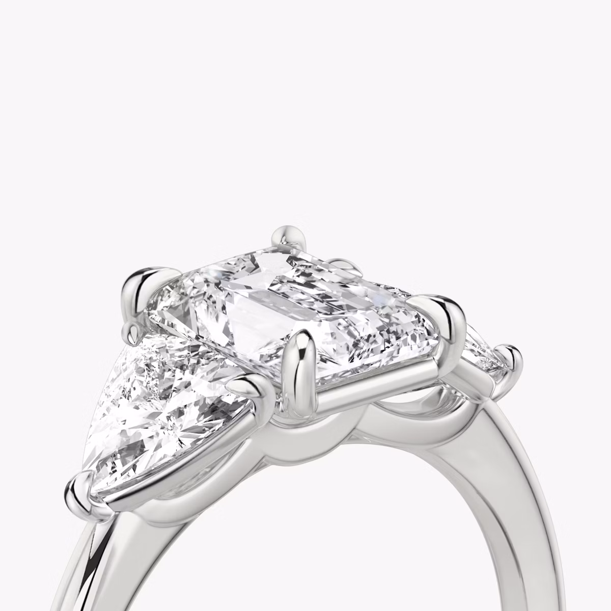 The Three Stone | Radiant | 18k | White Gold | bandAccent: Plain | sideStoneCarat: 0.50ct | sideStoneShape: Trillion | diamondOrientation: vertical | caratWeight: other