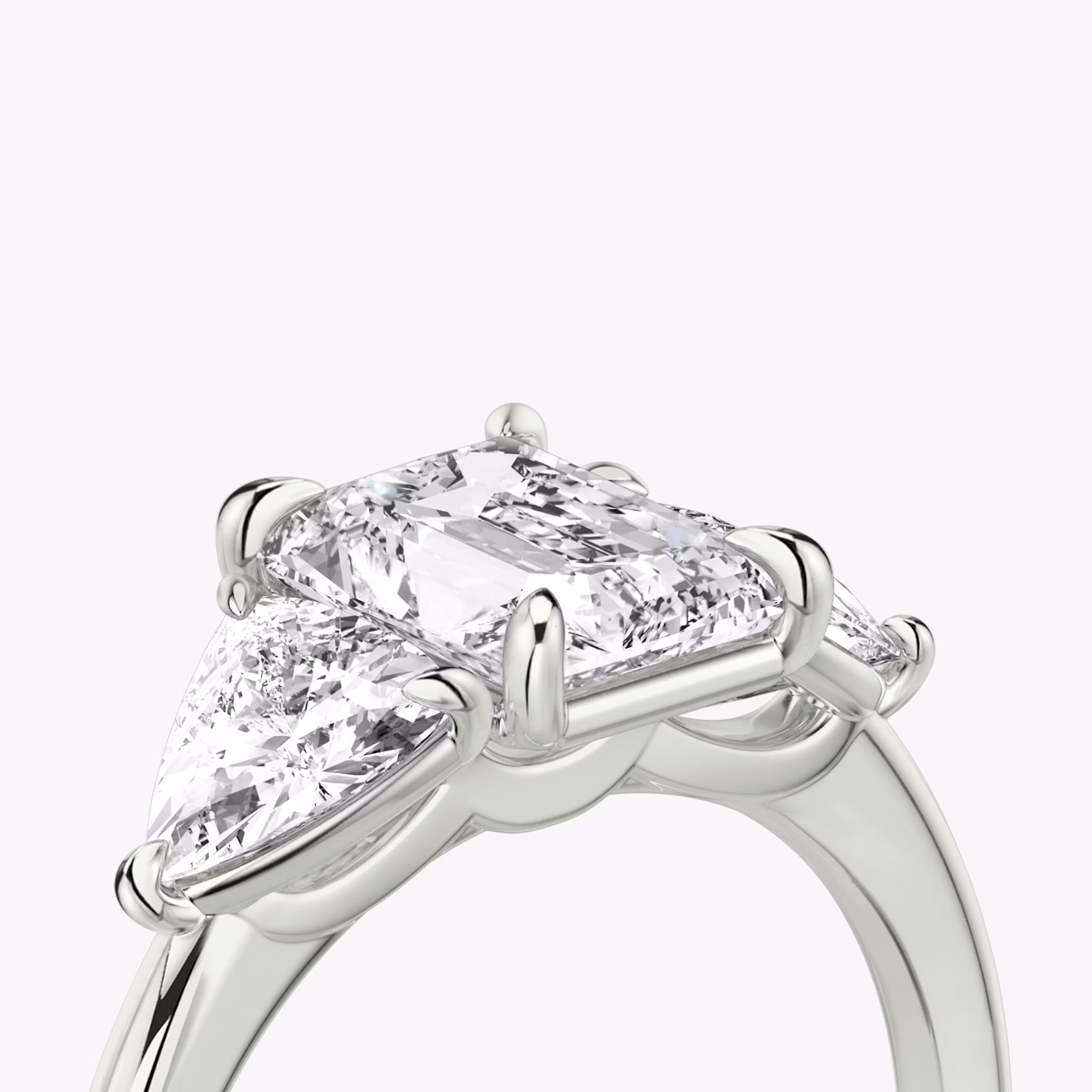 The Three Stone | Radiant | Platinum | bandAccent: Plain | sideStoneCarat: 0.50ct | sideStoneShape: Trillion | diamondOrientation: vertical | caratWeight: other