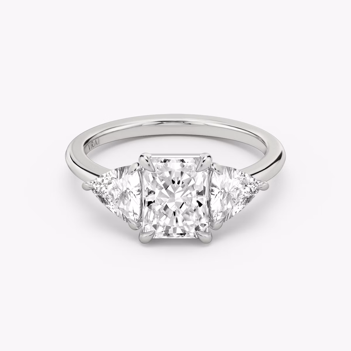 The Three Stone | Radiant | 18k | White Gold | bandAccent: Plain | sideStoneCarat: 0.50ct | sideStoneShape: Trillion | diamondOrientation: vertical | caratWeight: other