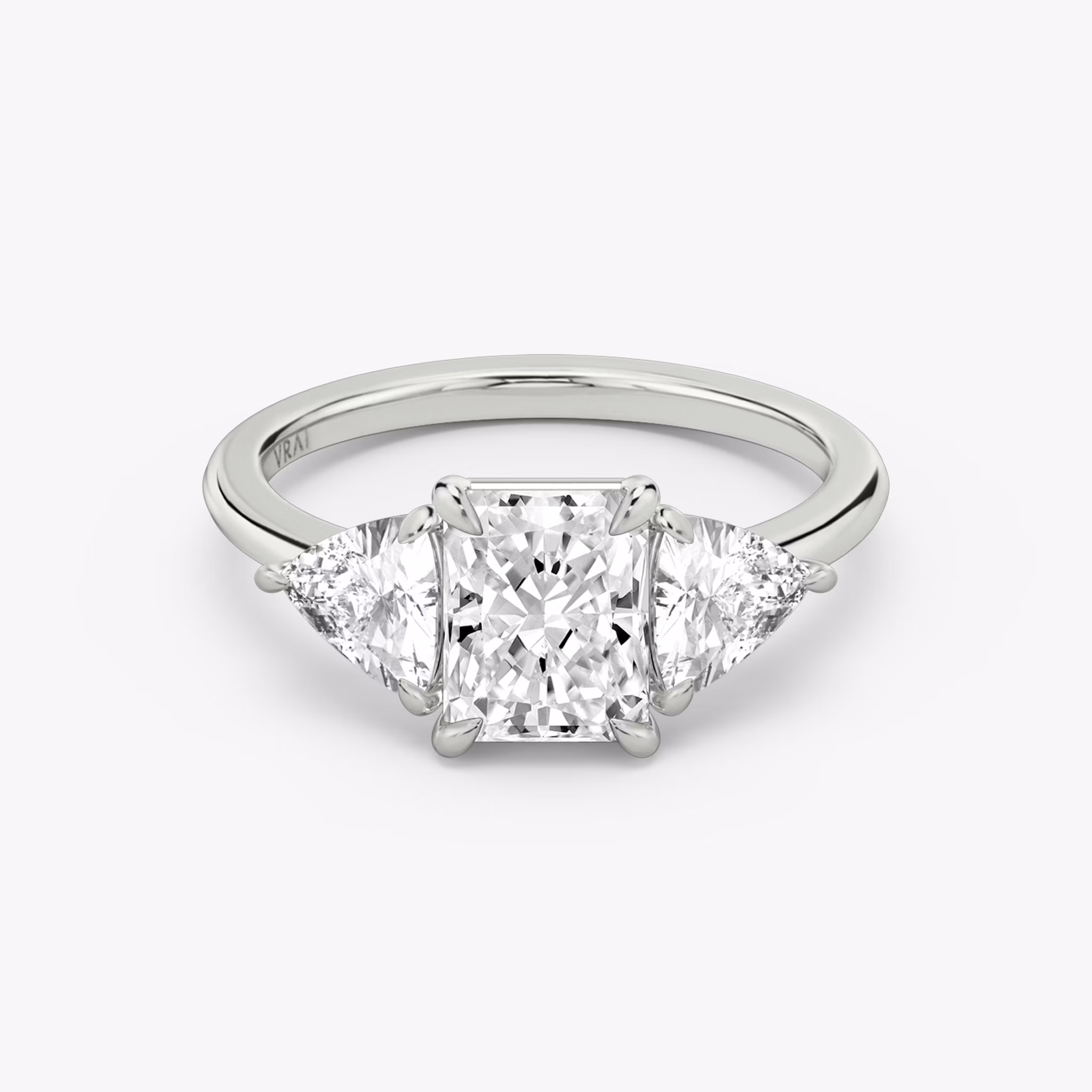 The Three Stone | Radiant | Platinum | bandAccent: Plain | sideStoneCarat: 0.50ct | sideStoneShape: Trillion | diamondOrientation: vertical | caratWeight: other