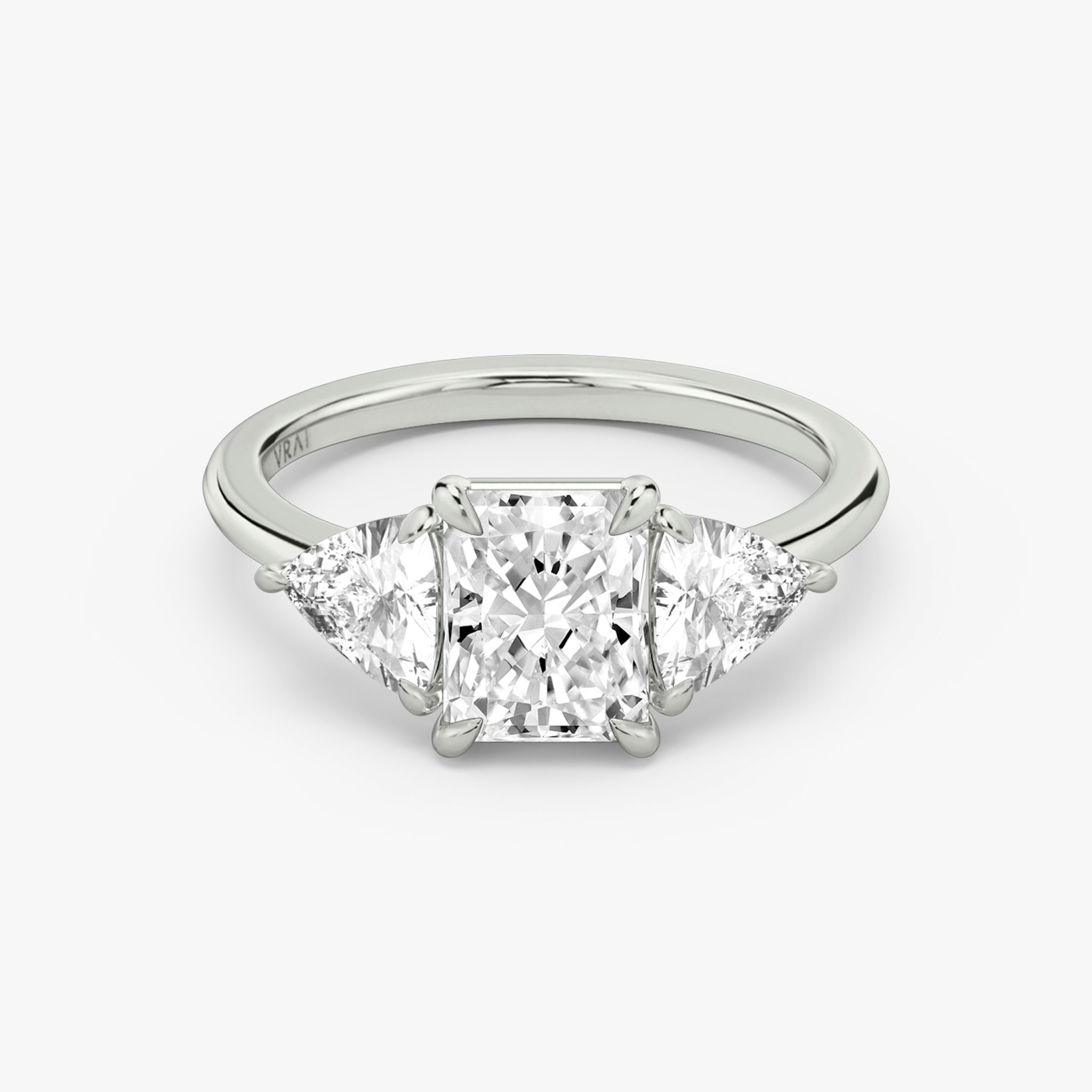 The Three Stone | Radiant | Platinum | bandAccent: Plain | sideStoneCarat: 0.50ct | sideStoneShape: Trillion | diamondOrientation: vertical | caratWeight: other