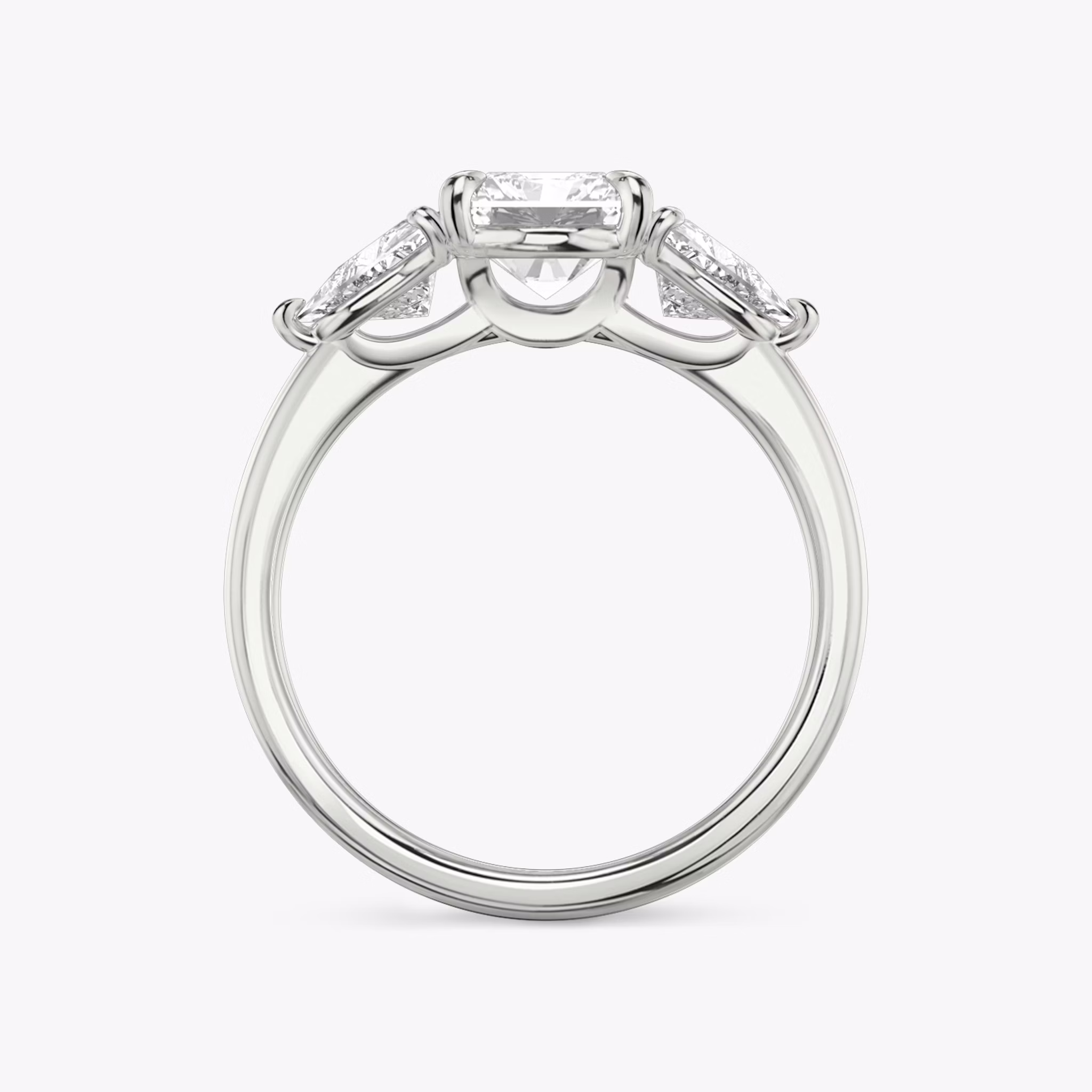 The Three Stone | Radiant | Platinum | bandAccent: Plain | sideStoneCarat: 0.50ct | sideStoneShape: Trillion | diamondOrientation: vertical | caratWeight: other