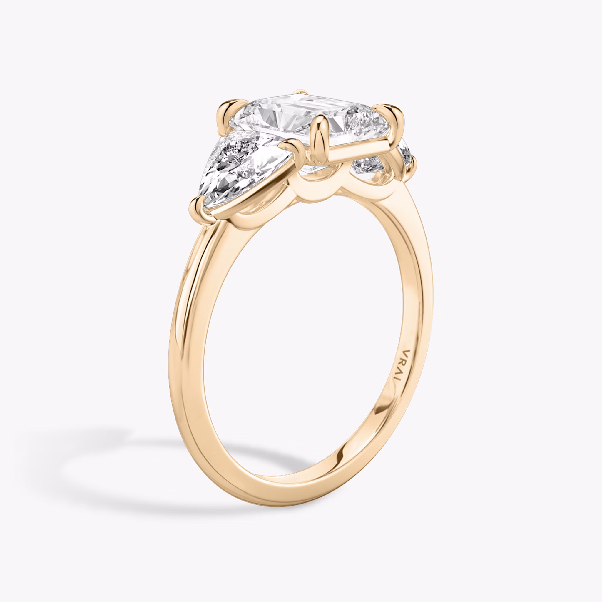 The Three Stone | Radiant | 14k | Rose Gold | bandAccent: Plain | sideStoneCarat: 0.50ct | sideStoneShape: Trillion | diamondOrientation: vertical | caratWeight: other