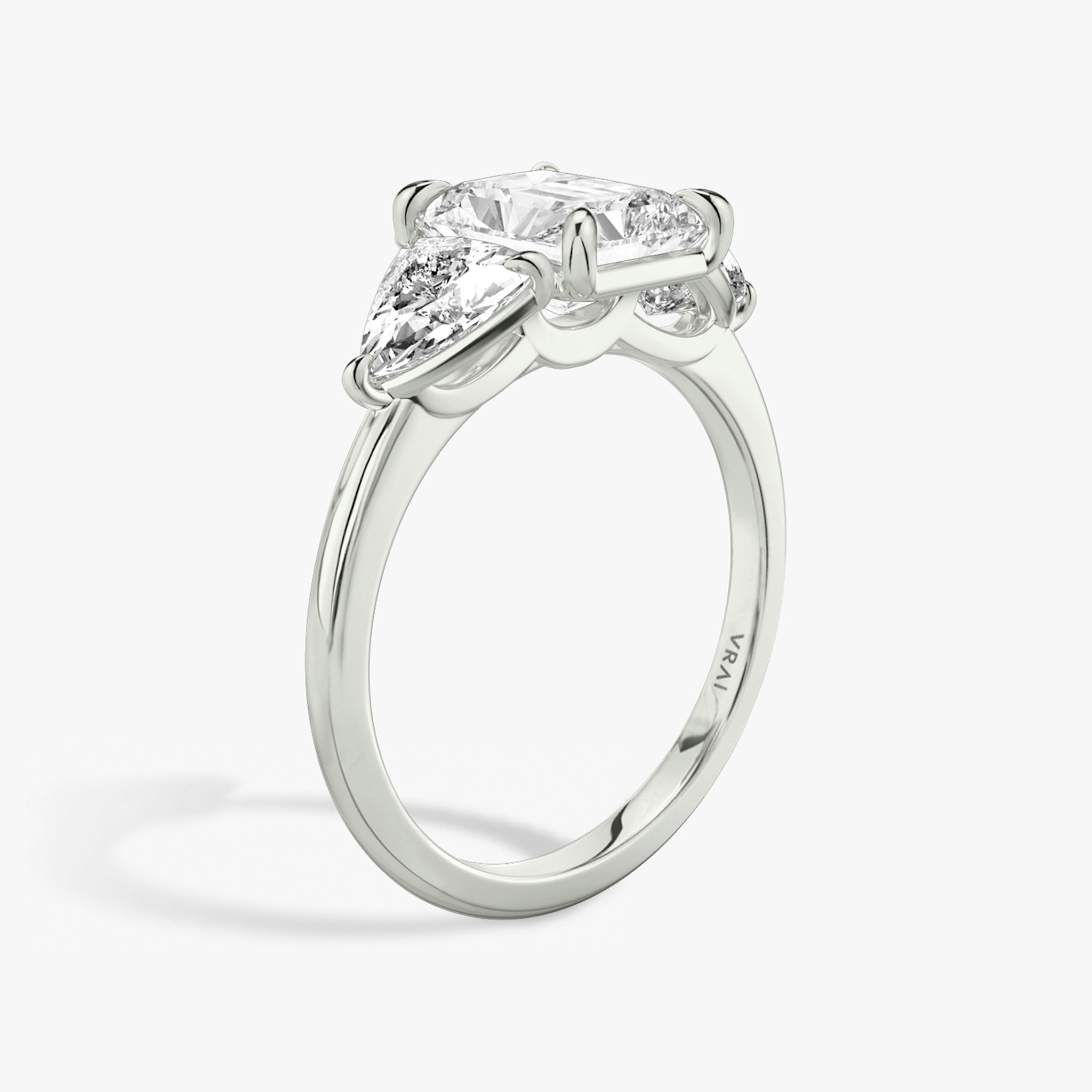 The Three Stone | Radiant | Platinum | bandAccent: Plain | sideStoneCarat: 0.50ct | sideStoneShape: Trillion | diamondOrientation: vertical | caratWeight: other
