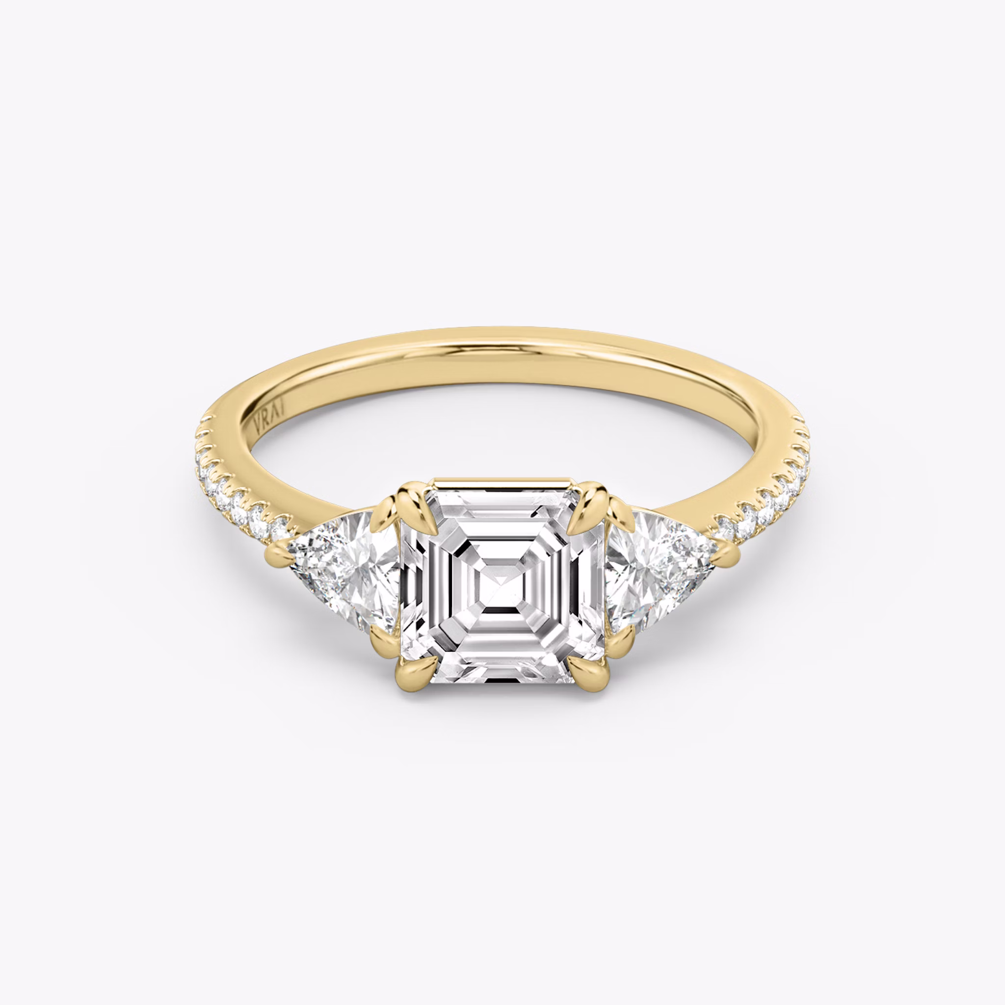 The Three Stone | Asscher | 18k | Yellow Gold | bandAccent: Pavé | sideStoneCarat: 0.25ct | sideStoneShape: Trillion | diamondOrientation: vertical | caratWeight: other