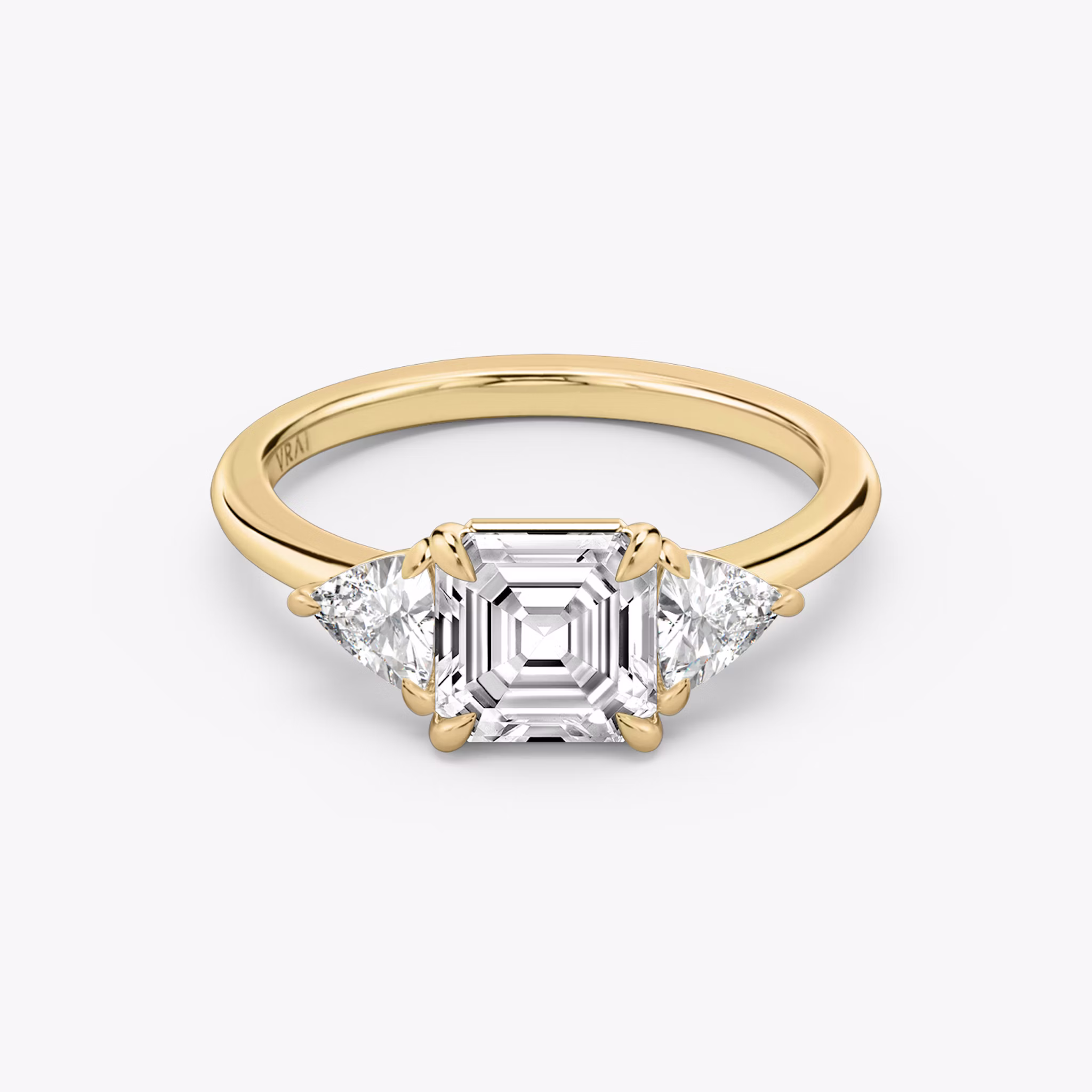The Three Stone | Asscher | 18k | Yellow Gold | bandAccent: Plain | sideStoneCarat: 0.25ct | sideStoneShape: Trillion | diamondOrientation: vertical | caratWeight: other