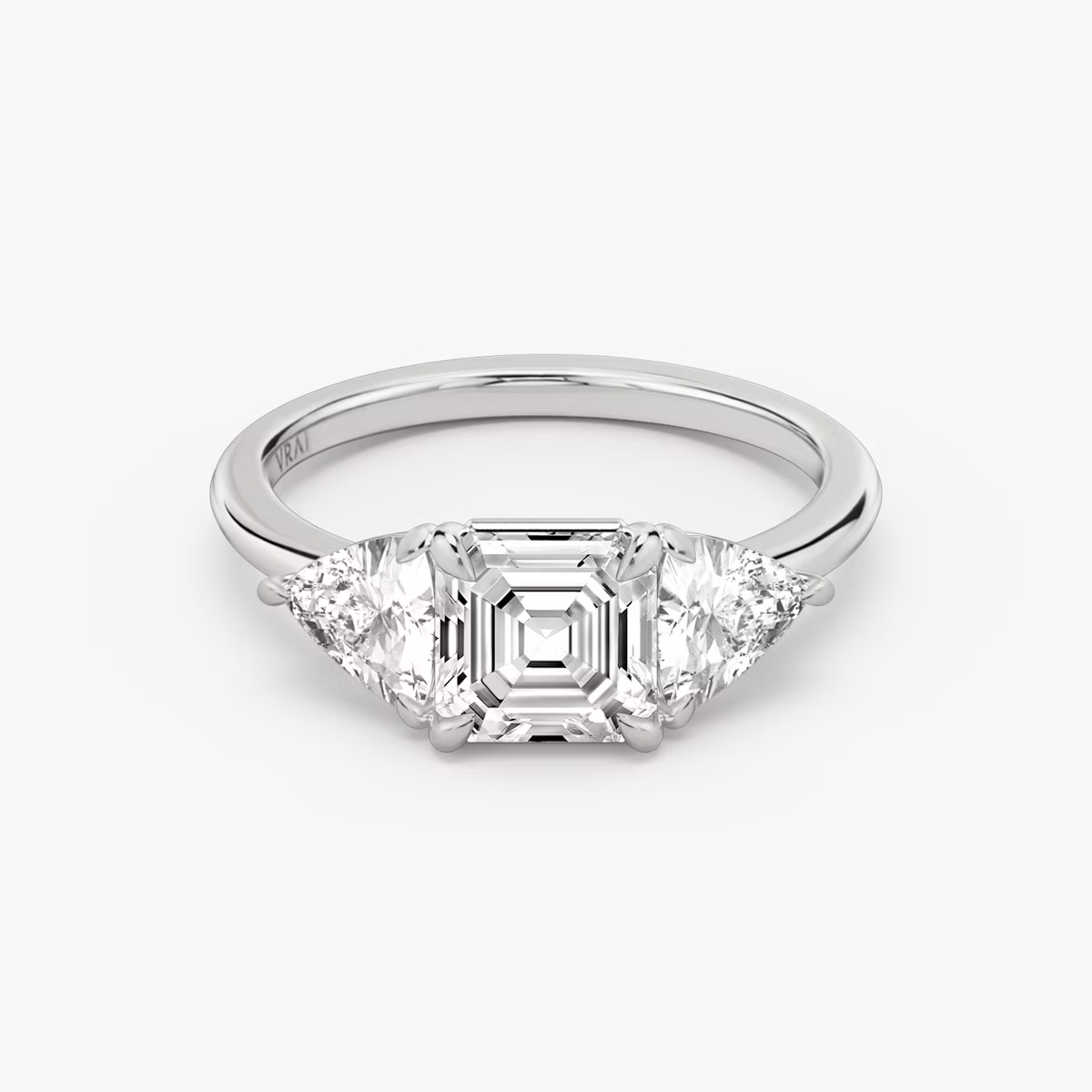 The Three Stone | Asscher | 18k | White Gold | bandAccent: Plain | sideStoneCarat: 0.50ct | sideStoneShape: Trillion | diamondOrientation: vertical | caratWeight: other