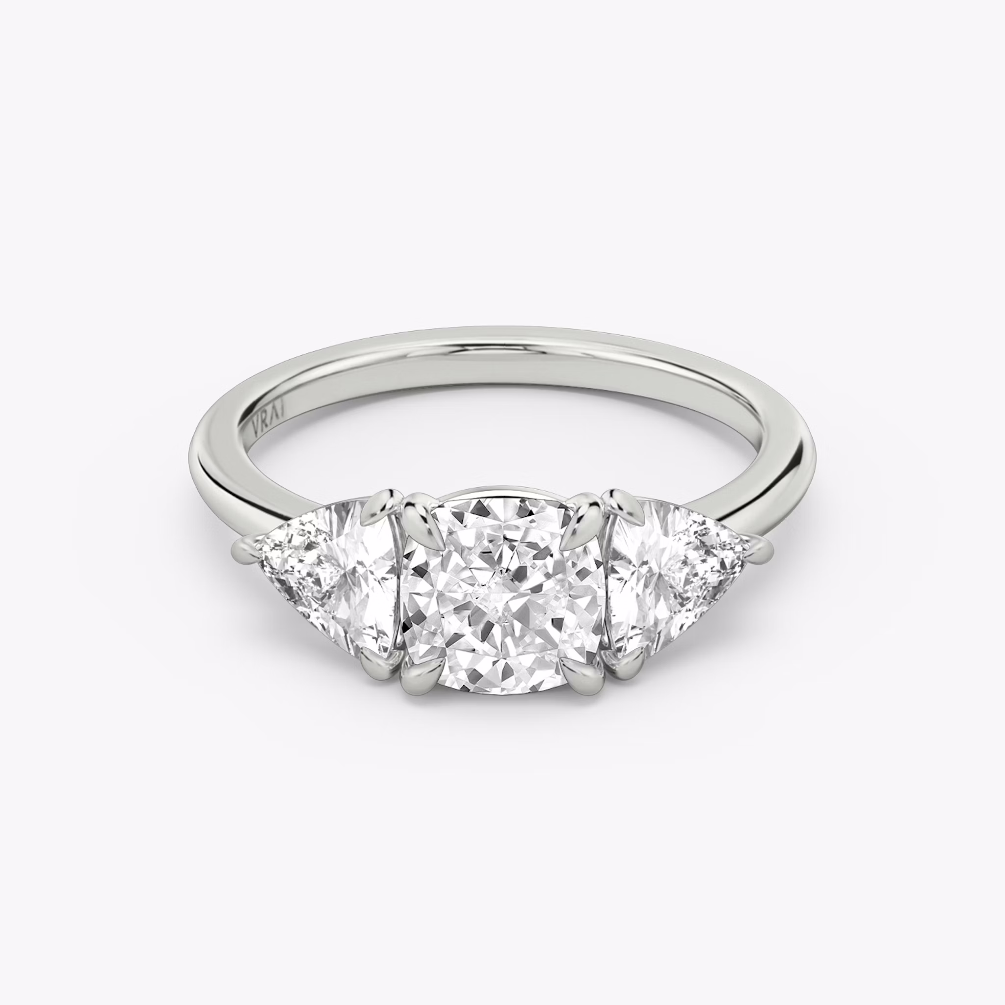 The Three Stone | Cushion | 18k | White Gold | bandAccent: Plain | sideStoneCarat: 0.50ct | sideStoneShape: Trillion | diamondOrientation: vertical | caratWeight: other