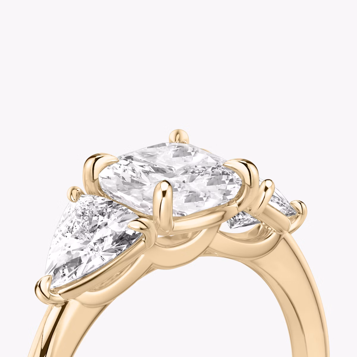 The Three Stone | Cushion | 14k | Rose Gold | bandAccent: Plain | sideStoneCarat: 0.50ct | sideStoneShape: Trillion | diamondOrientation: vertical | caratWeight: other