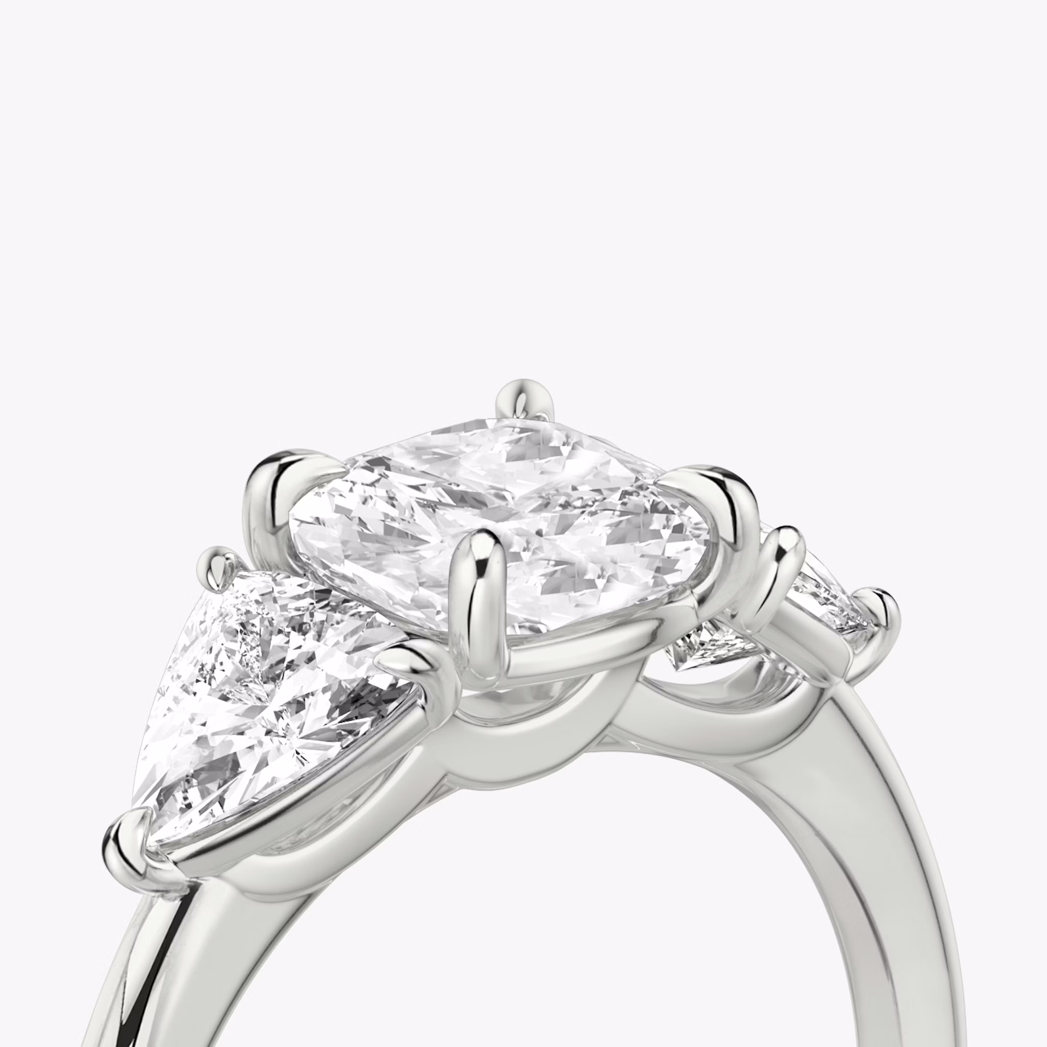 The Three Stone | Cushion | Platinum | bandAccent: Plain | sideStoneCarat: 0.50ct | sideStoneShape: Trillion | diamondOrientation: vertical | caratWeight: other