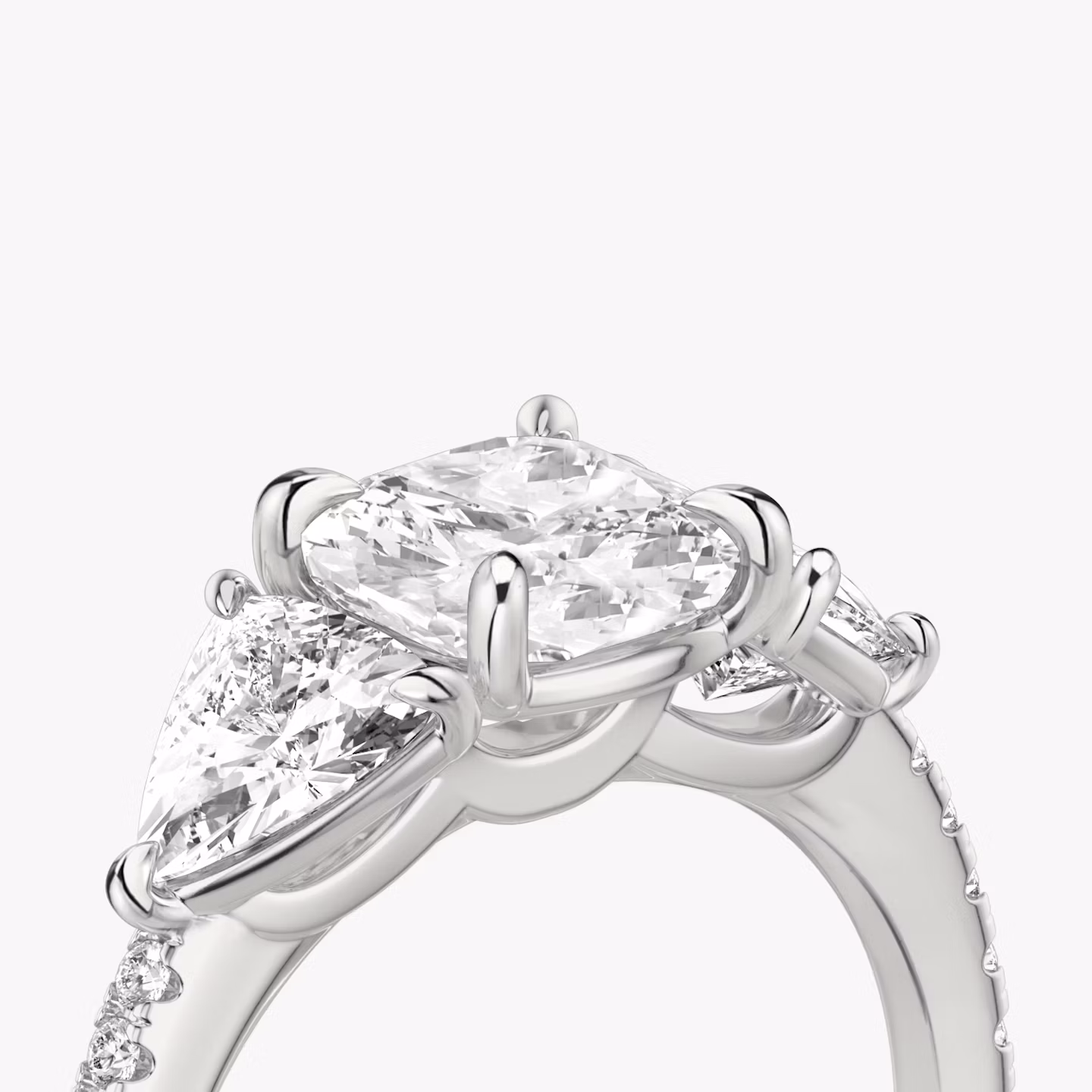The Three Stone | Cushion | 18k | White Gold | bandAccent: Pavé | sideStoneCarat: 0.50ct | sideStoneShape: Trillion | diamondOrientation: vertical | caratWeight: other