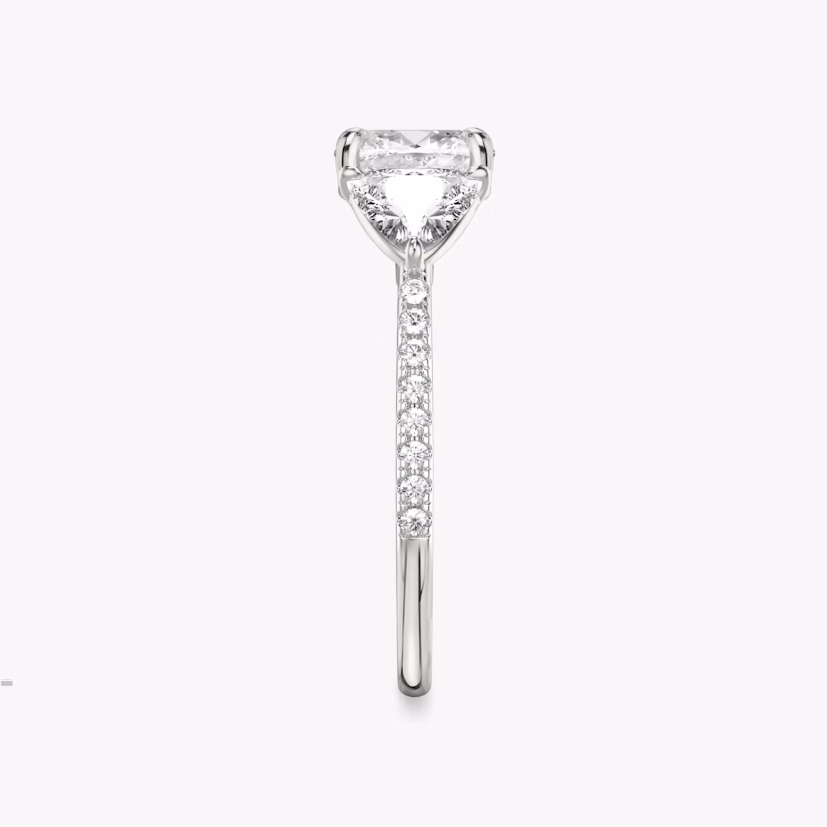 The Three Stone | Cushion | 18k | White Gold | bandAccent: Pavé | sideStoneCarat: 0.50ct | sideStoneShape: Trillion | diamondOrientation: vertical | caratWeight: other