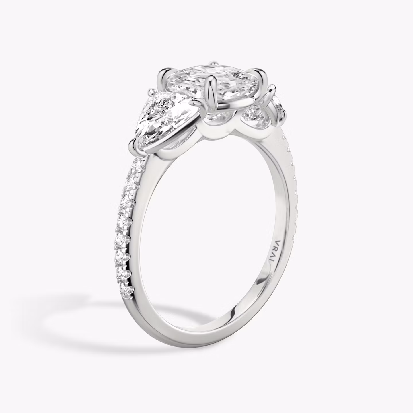 The Three Stone | Cushion | 18k | White Gold | bandAccent: Pavé | sideStoneCarat: 0.50ct | sideStoneShape: Trillion | diamondOrientation: vertical | caratWeight: other