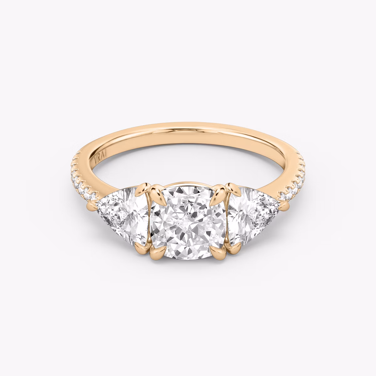 The Three Stone | Cushion | 14k | Rose Gold | bandAccent: Pavé | sideStoneCarat: 0.50ct | sideStoneShape: Trillion | diamondOrientation: vertical | caratWeight: other