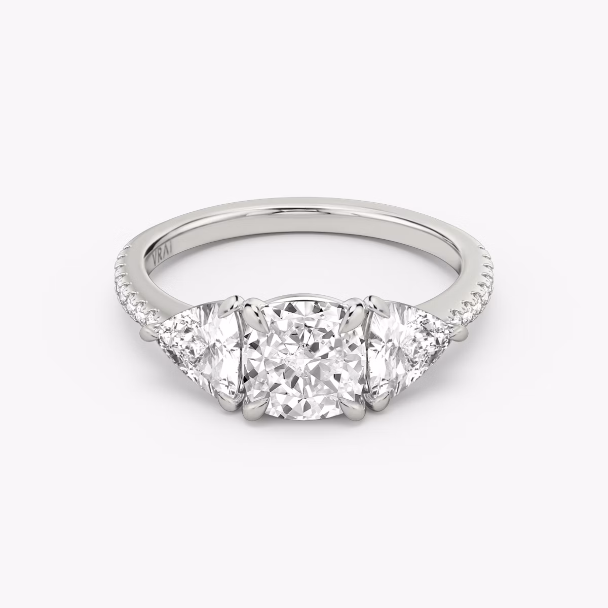 The Three Stone | Cushion | Platinum | bandAccent: Pavé | sideStoneCarat: 0.50ct | sideStoneShape: Trillion | diamondOrientation: vertical | caratWeight: other