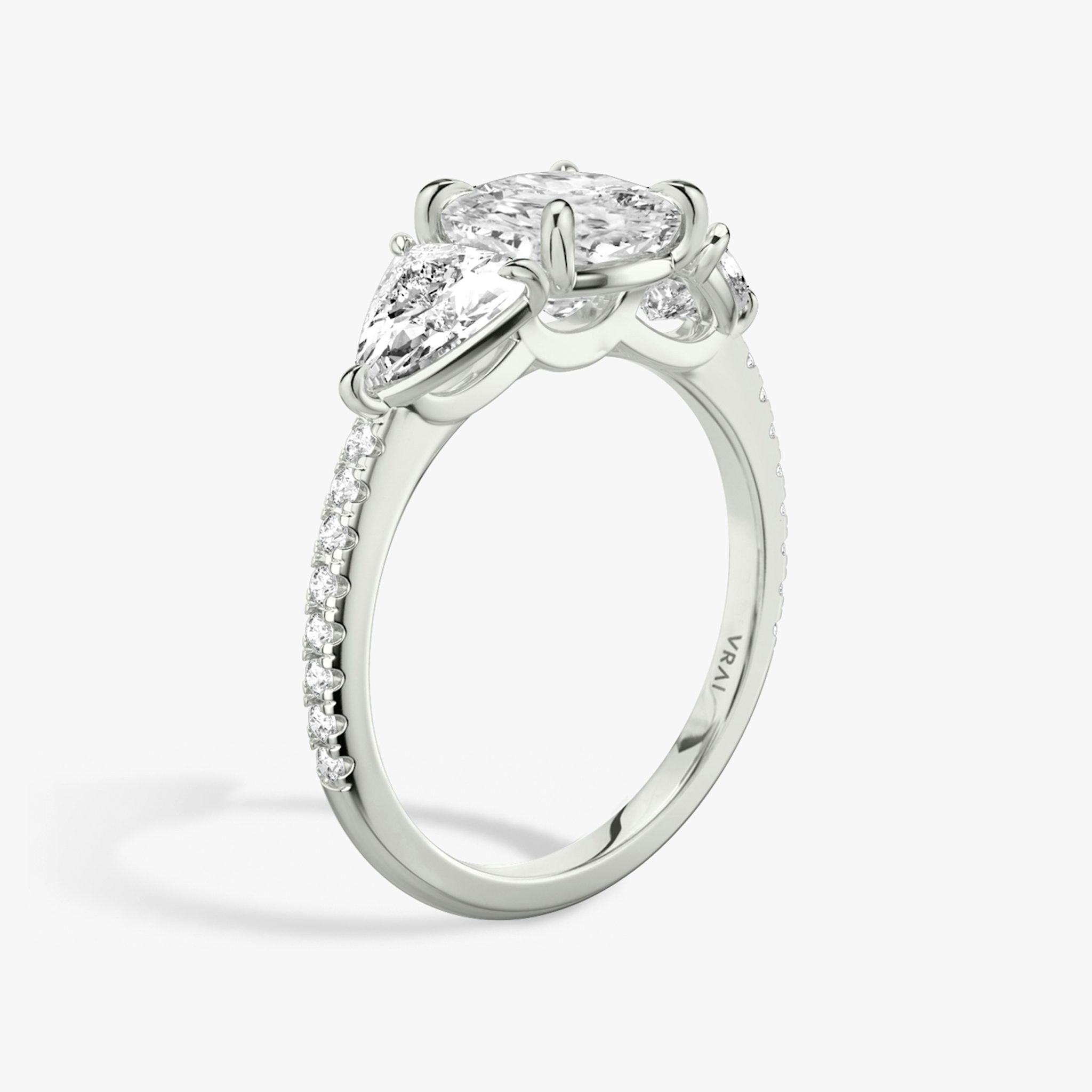 The Three Stone | Cushion | Platinum | bandAccent: Pavé | sideStoneCarat: 0.50ct | sideStoneShape: Trillion | diamondOrientation: vertical | caratWeight: other