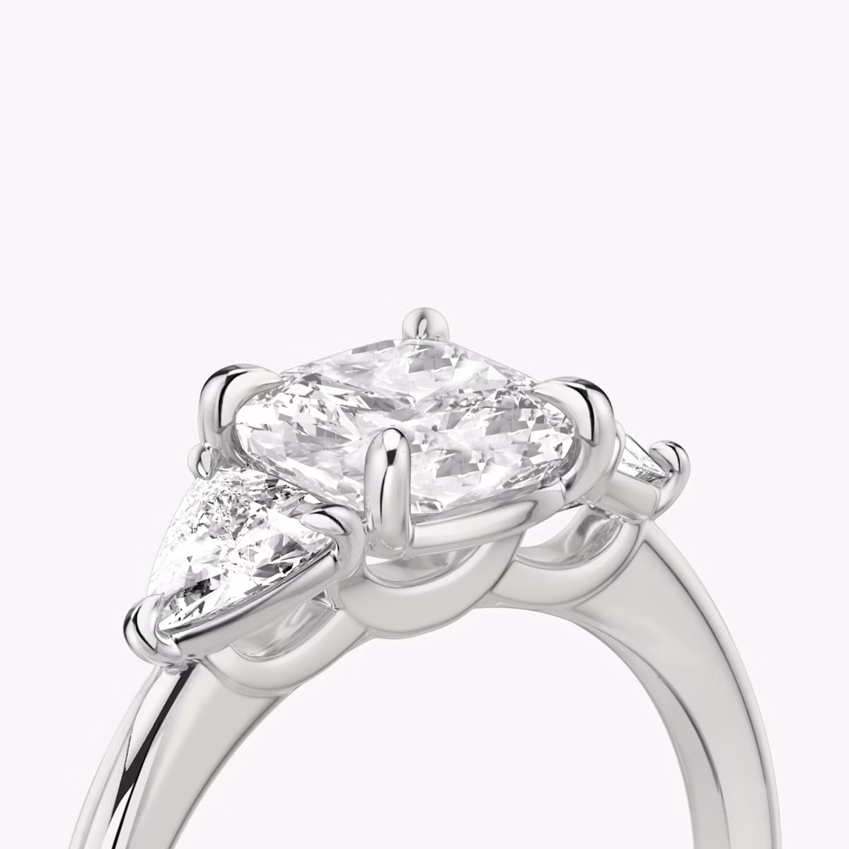 The Three Stone | Cushion | 18k | White Gold | bandAccent: Plain | sideStoneCarat: 0.25ct | sideStoneShape: Trillion | diamondOrientation: vertical | caratWeight: other