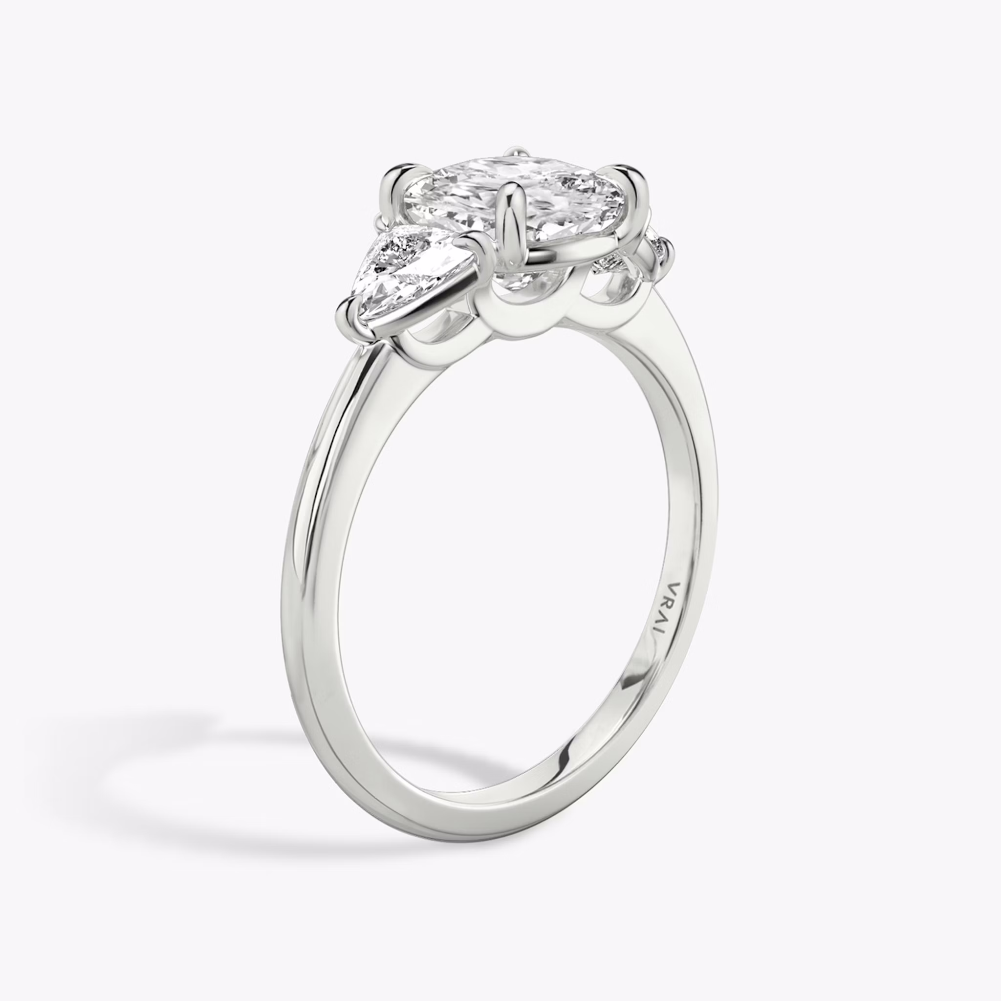 The Three Stone | Cushion | 18k | White Gold | bandAccent: Plain | sideStoneCarat: 0.25ct | sideStoneShape: Trillion | diamondOrientation: vertical | caratWeight: other