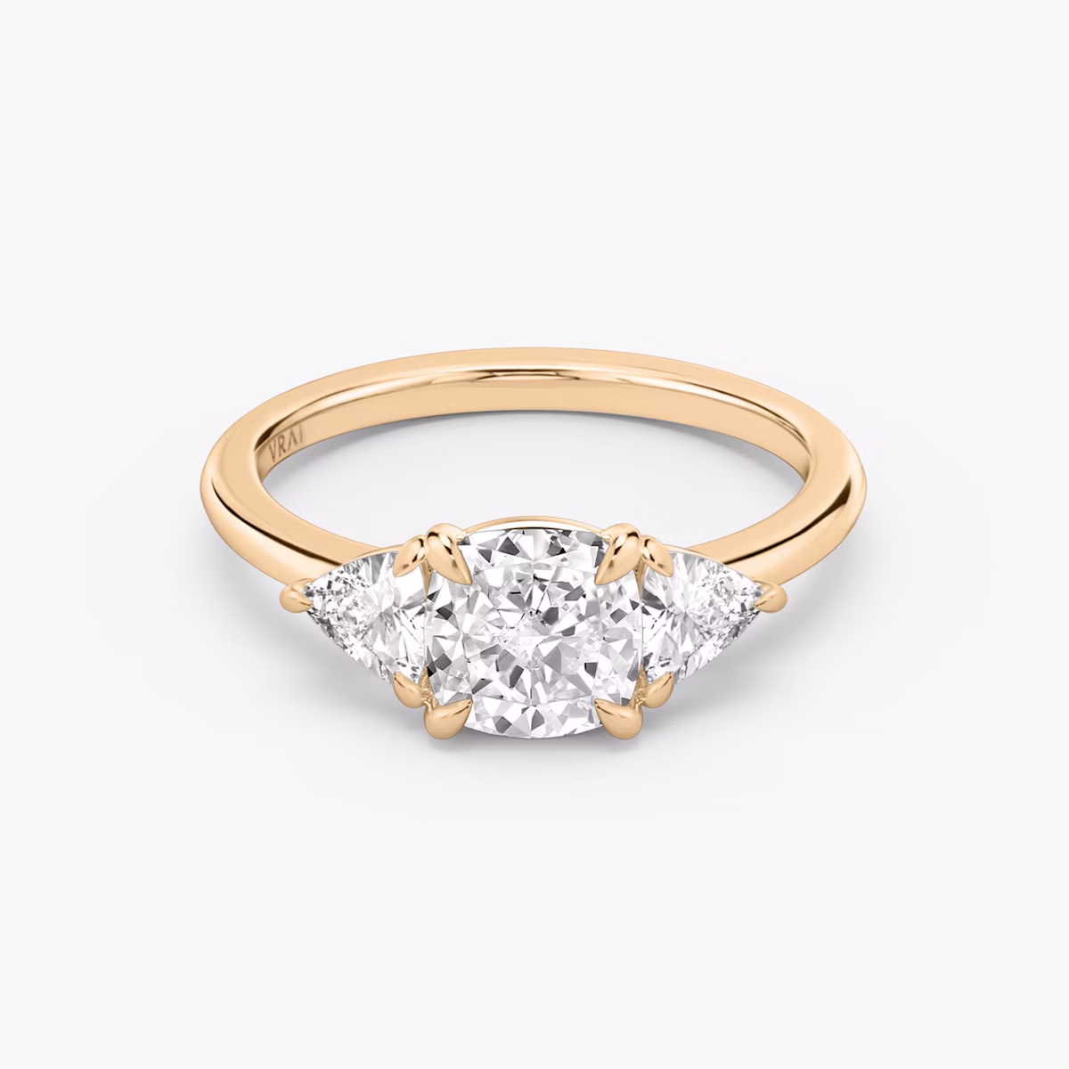 The Three Stone | Cushion | 14k | Rose Gold | bandAccent: Plain | sideStoneCarat: 0.25ct | sideStoneShape: Trillion | diamondOrientation: vertical | caratWeight: other