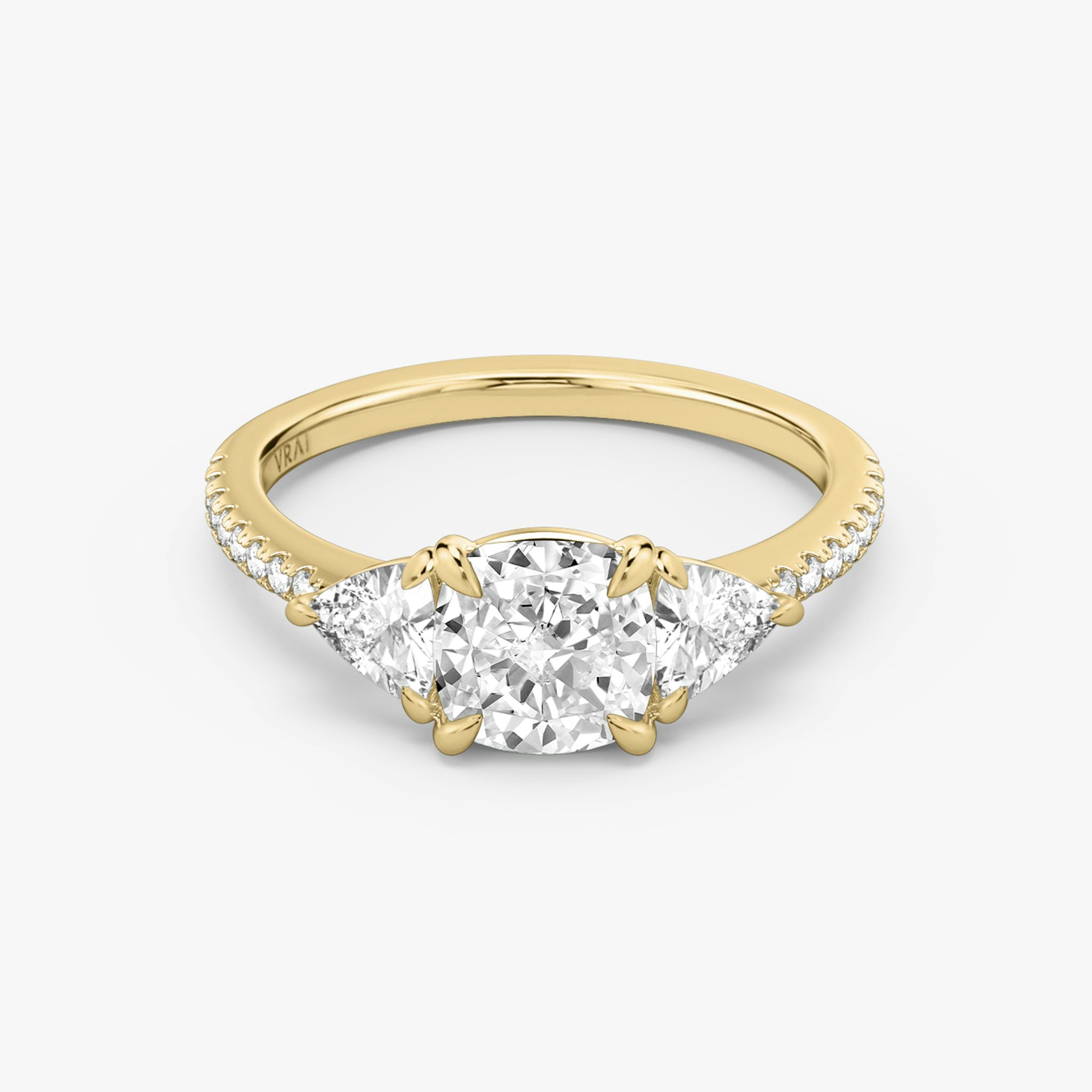 The Three Stone | Cushion | 18k | Yellow Gold | bandAccent: Pavé | sideStoneCarat: 0.25ct | sideStoneShape: Trillion | diamondOrientation: vertical | caratWeight: other