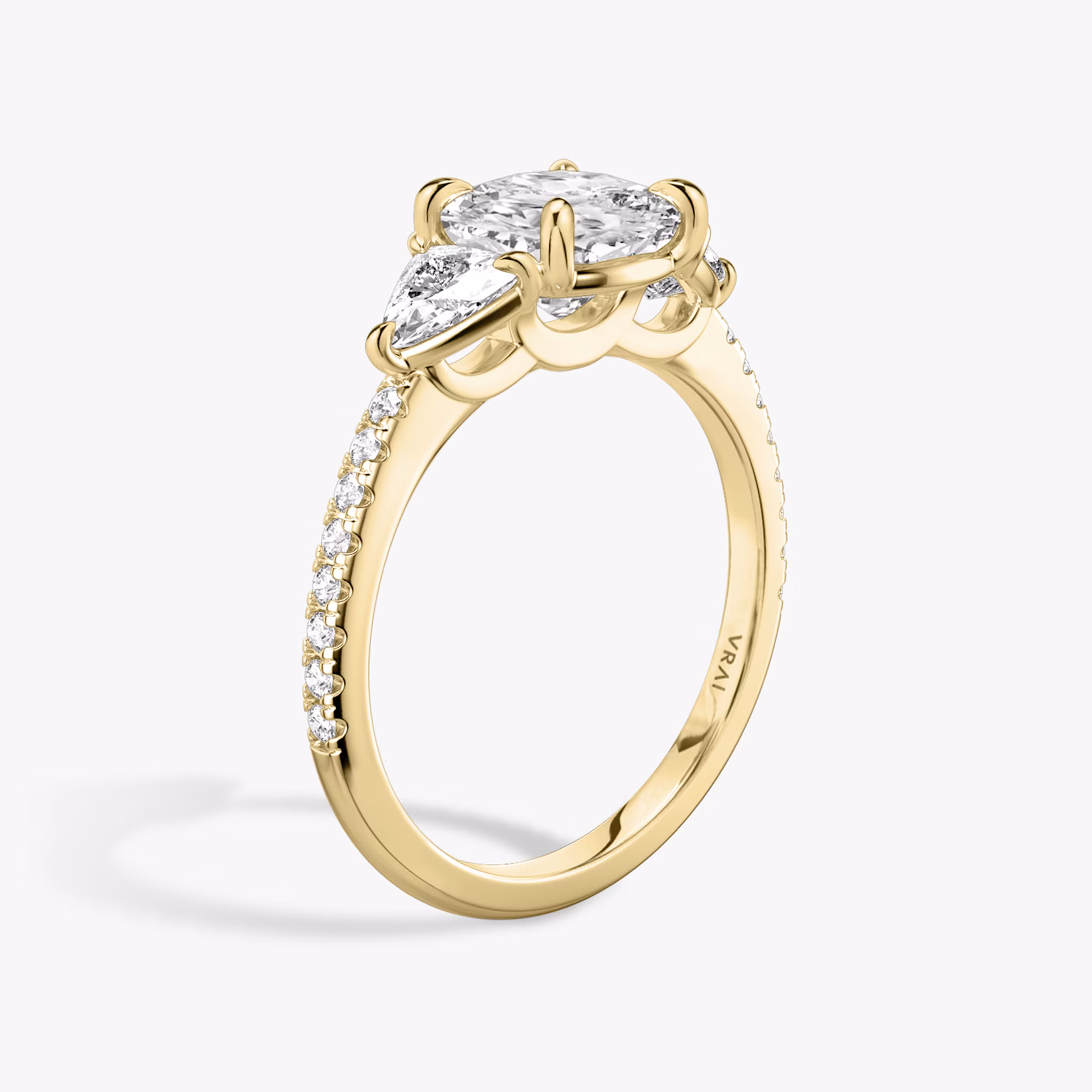 The Three Stone | Cushion | 18k | Yellow Gold | bandAccent: Pavé | sideStoneCarat: 0.25ct | sideStoneShape: Trillion | diamondOrientation: vertical | caratWeight: other
