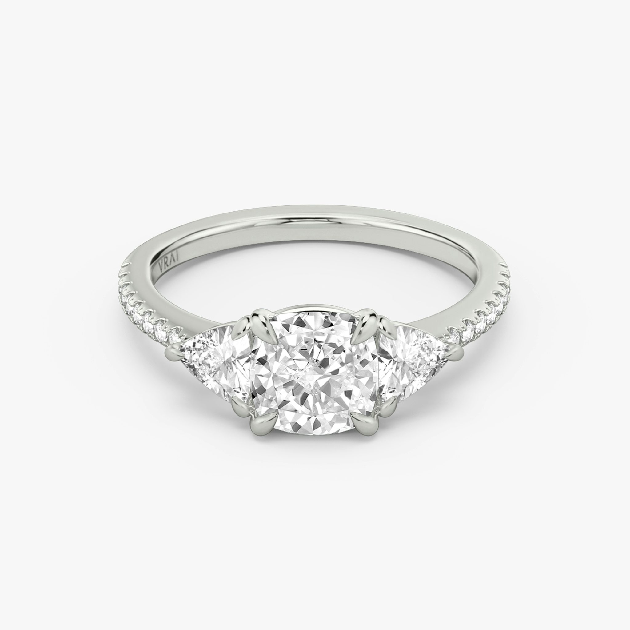 The Three Stone | Cushion | 18k | White Gold | bandAccent: Pavé | sideStoneCarat: 0.25ct | sideStoneShape: Trillion | diamondOrientation: vertical | caratWeight: other