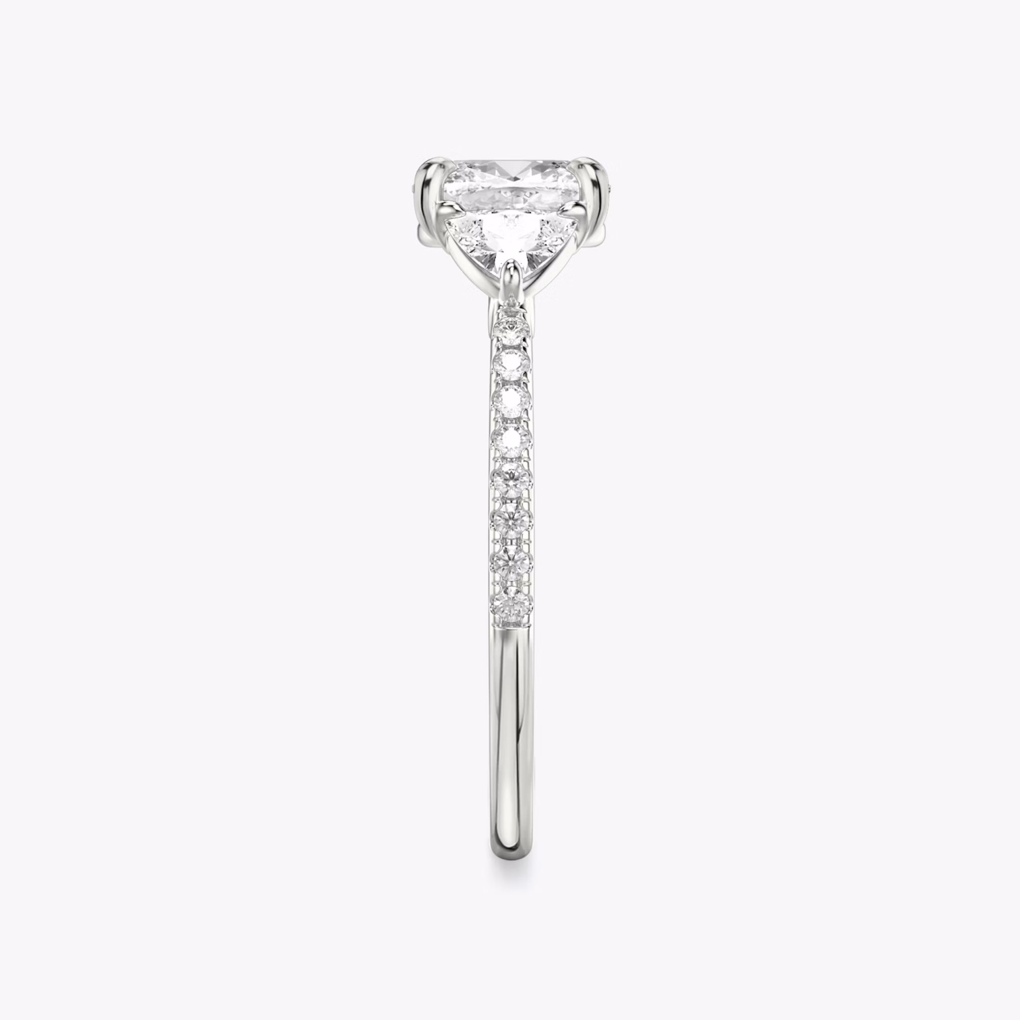 The Three Stone | Cushion | 18k | White Gold | bandAccent: Pavé | sideStoneCarat: 0.25ct | sideStoneShape: Trillion | diamondOrientation: vertical | caratWeight: other