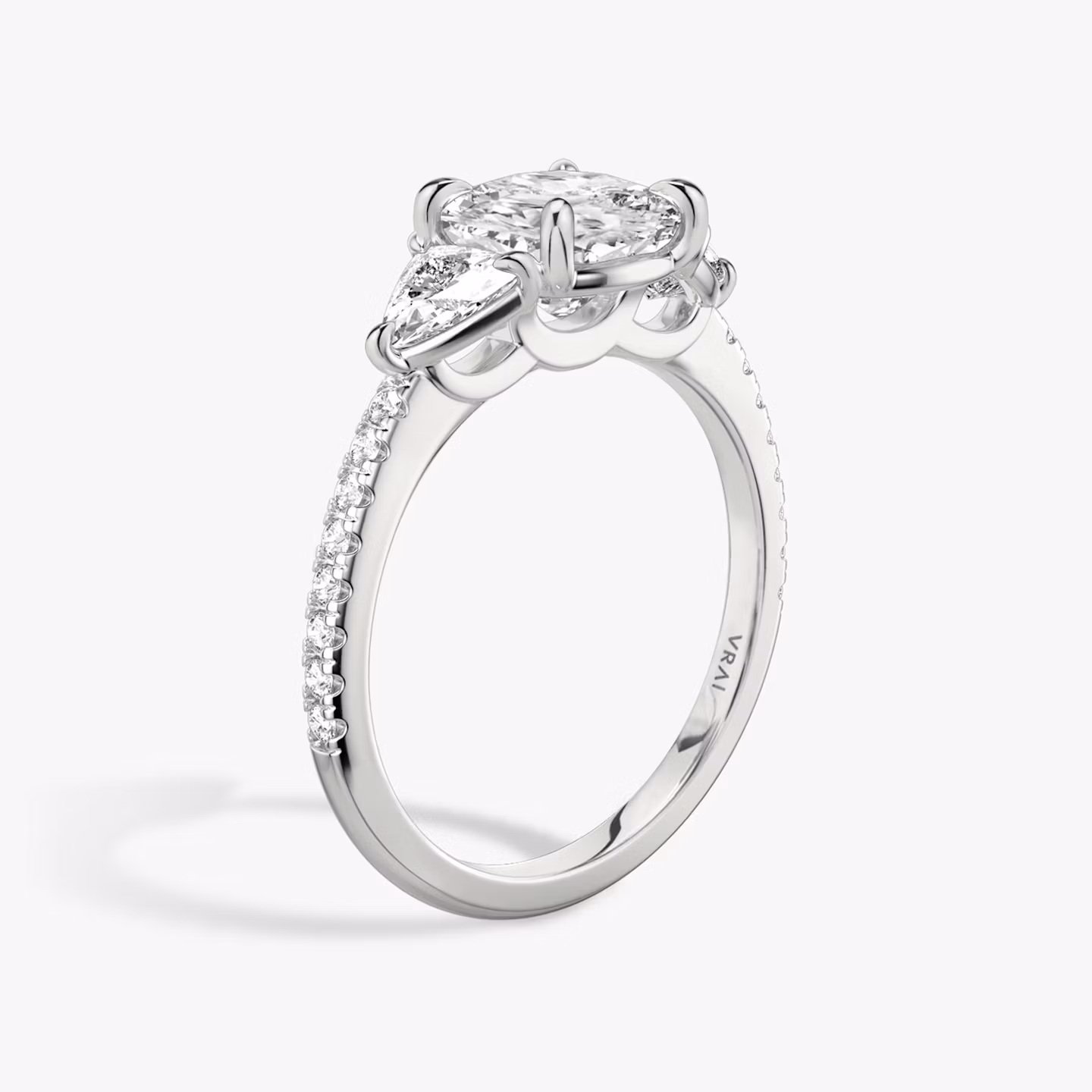 The Three Stone | Cushion | 18k | White Gold | bandAccent: Pavé | sideStoneCarat: 0.25ct | sideStoneShape: Trillion | diamondOrientation: vertical | caratWeight: other
