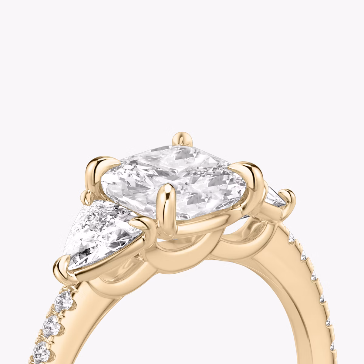The Three Stone | Cushion | 14k | Rose Gold | bandAccent: Pavé | sideStoneCarat: 0.25ct | sideStoneShape: Trillion | diamondOrientation: vertical | caratWeight: other