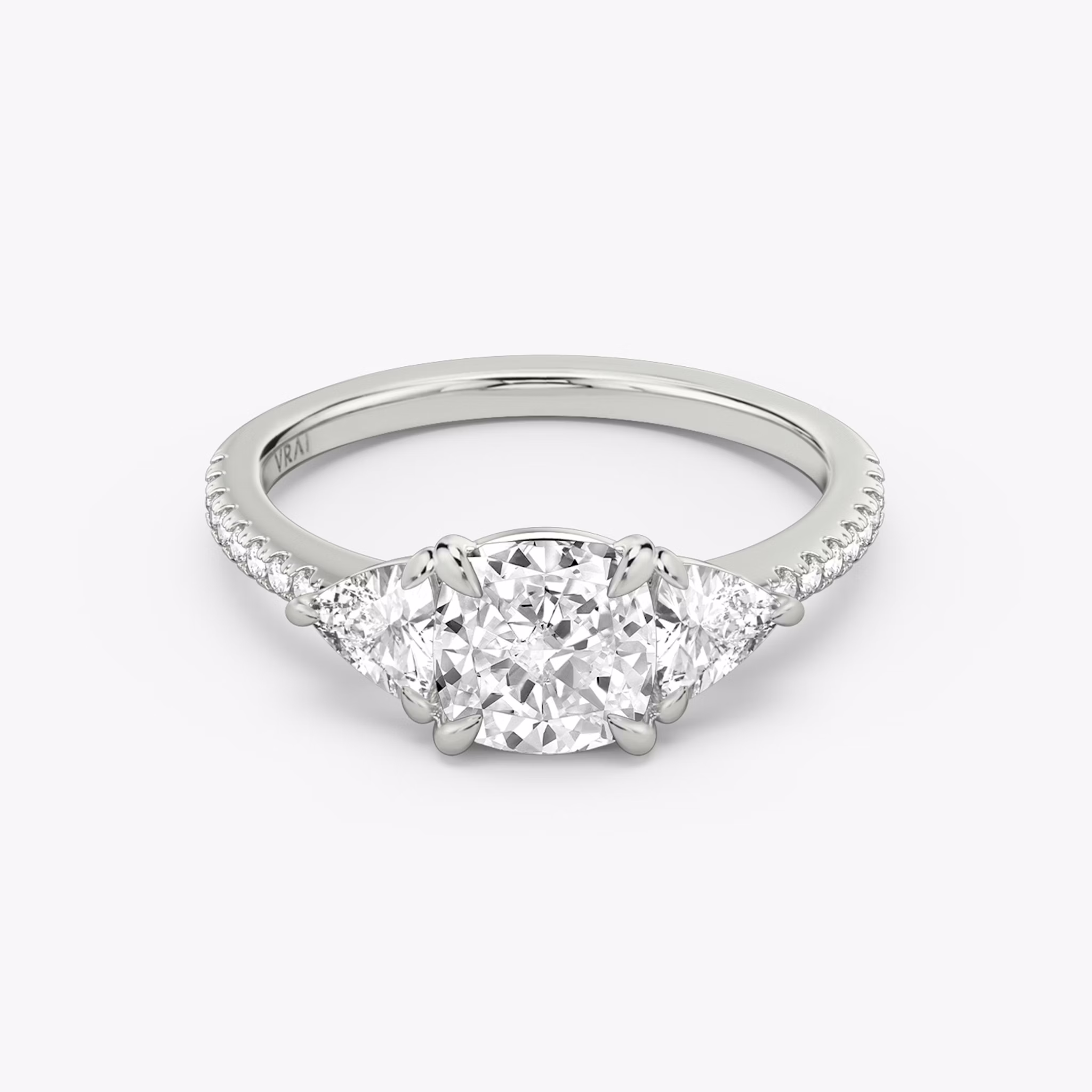 The Three Stone | Cushion | Platinum | bandAccent: Pavé | sideStoneCarat: 0.25ct | sideStoneShape: Trillion | diamondOrientation: vertical | caratWeight: other