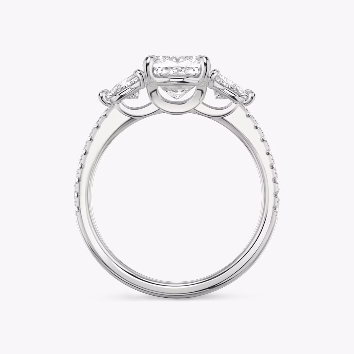 Anillo de compromiso Three Stone | Cojín | Platino | bandAccent: Pavé | sideStoneCarat: 0.25ct | sideStoneShape: Trillón | diamondOrientation: vertical | caratWeight: other