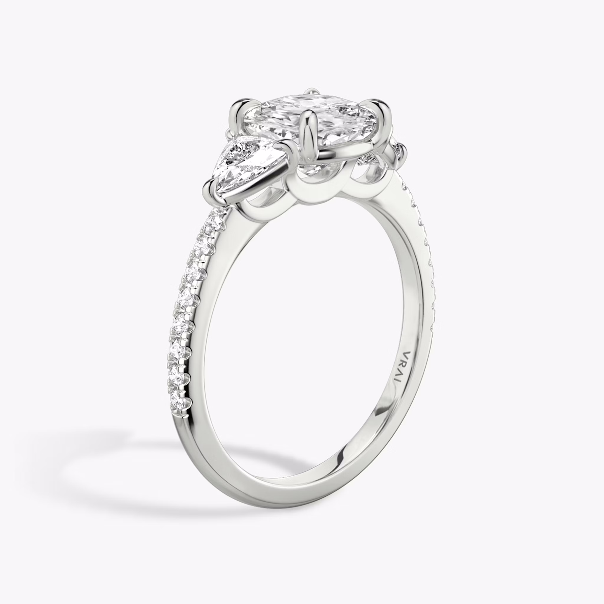 The Three Stone | Cushion | Platinum | bandAccent: Pavé | sideStoneCarat: 0.25ct | sideStoneShape: Trillion | diamondOrientation: vertical | caratWeight: other