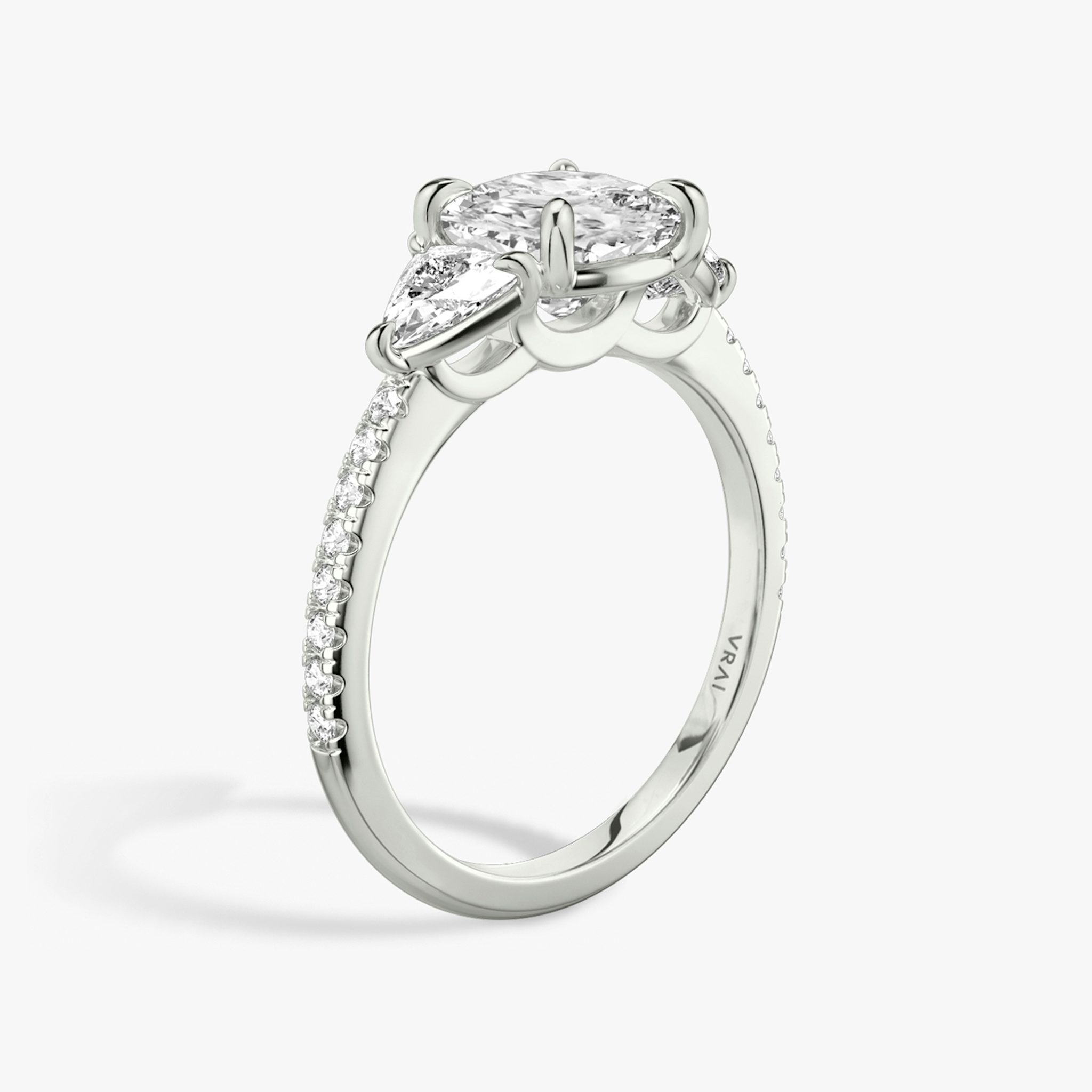 The Three Stone | Cushion | Platinum | bandAccent: Pavé | sideStoneCarat: 0.25ct | sideStoneShape: Trillion | diamondOrientation: vertical | caratWeight: other