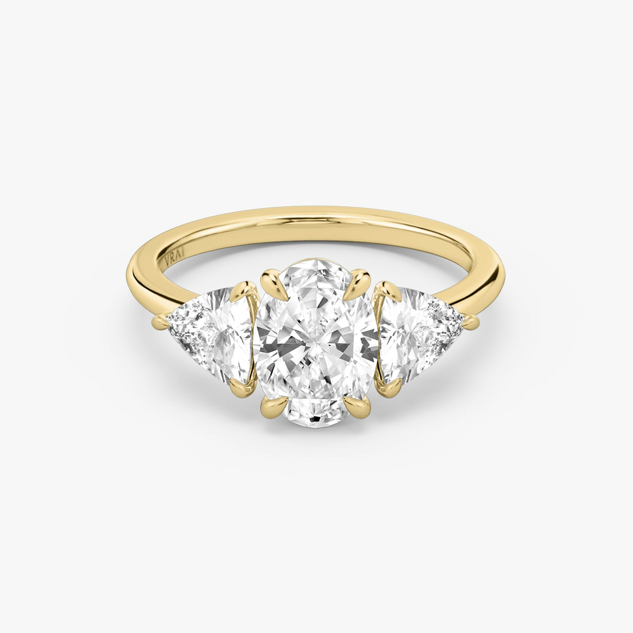 The Three Stone | Oval | 18k | Yellow Gold | bandAccent: Plain | sideStoneCarat: 0.50ct | sideStoneShape: Trillion | diamondOrientation: vertical | caratWeight: other