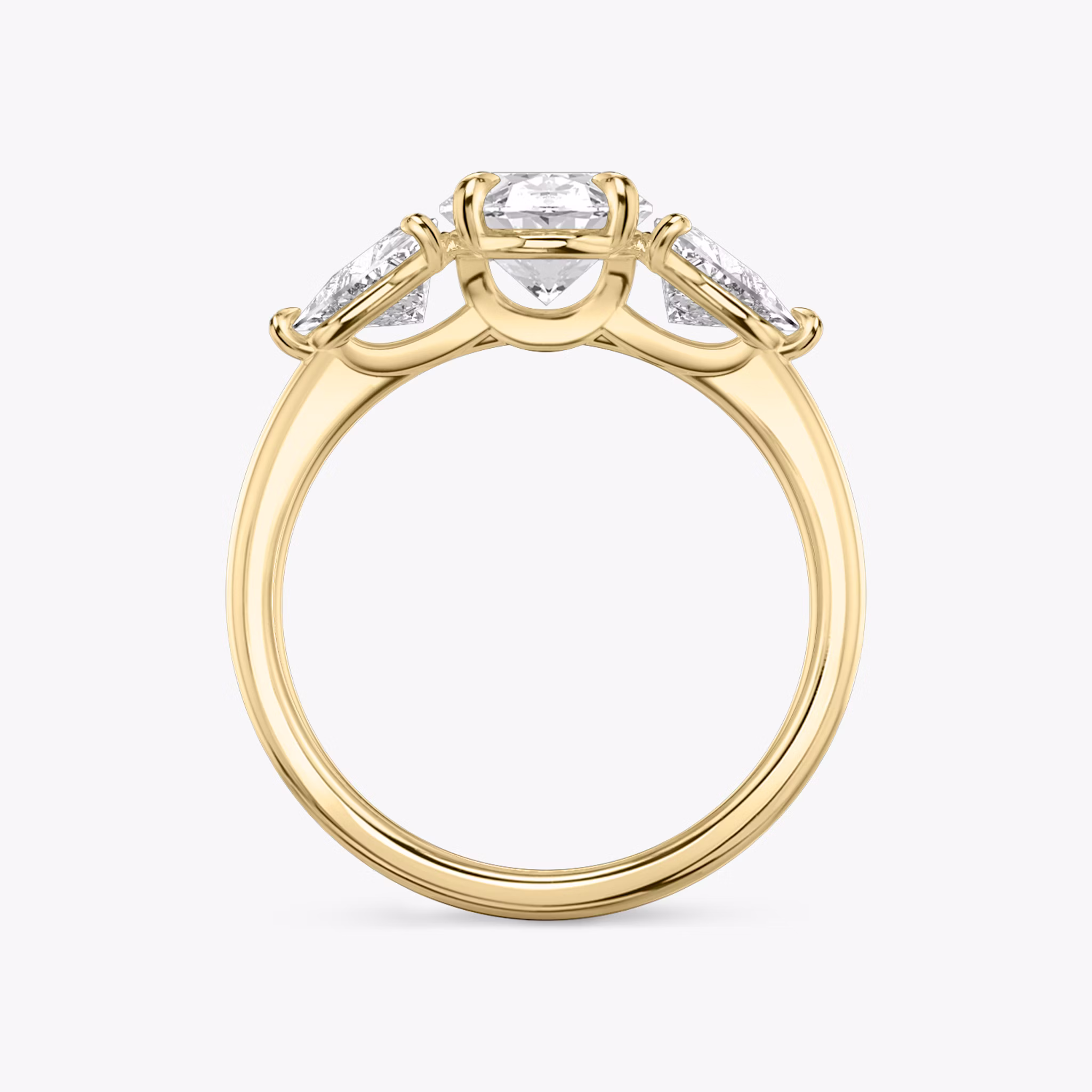 The Three Stone | Oval | 18k | Yellow Gold | bandAccent: Plain | sideStoneCarat: 0.50ct | sideStoneShape: Trillion | diamondOrientation: vertical | caratWeight: other