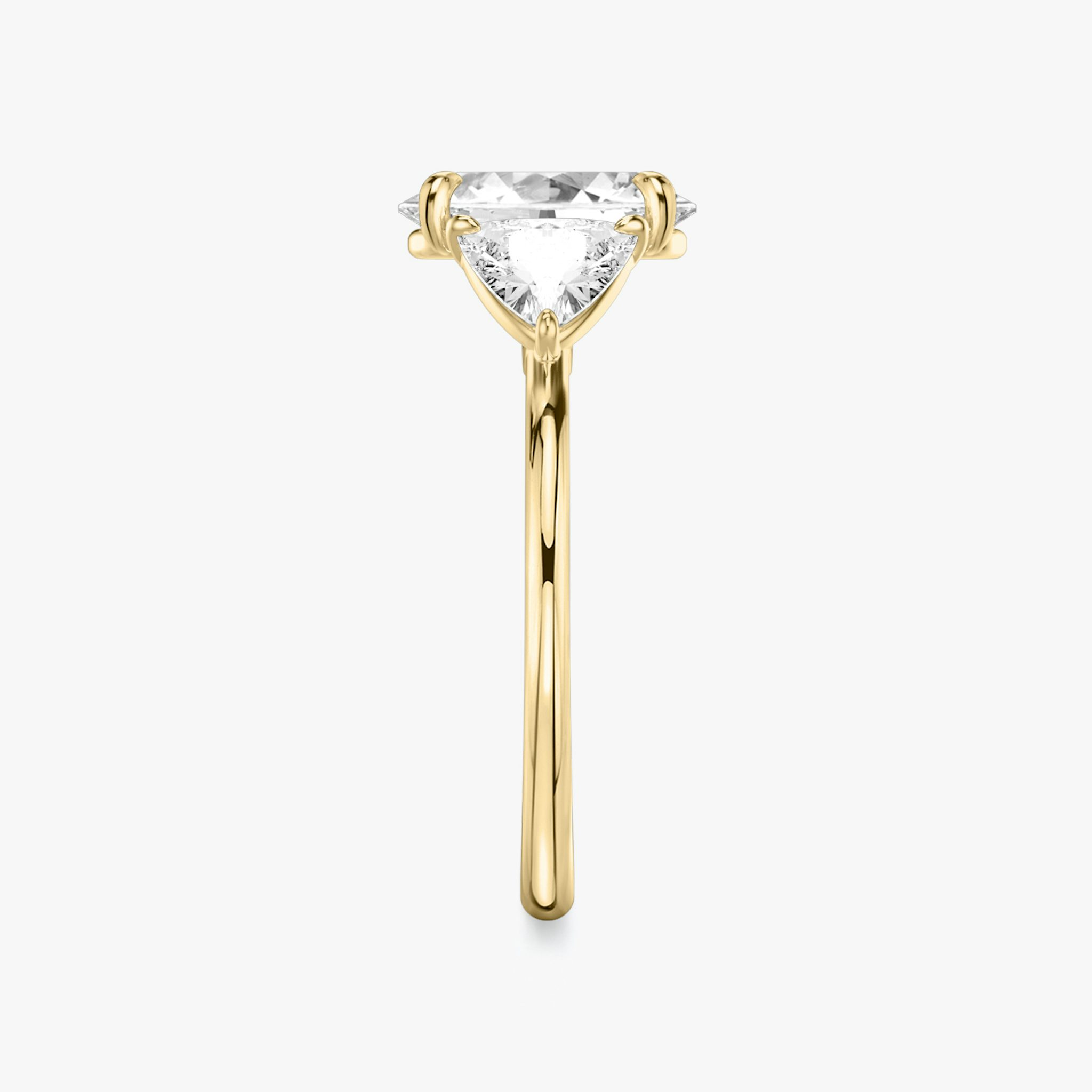 The Three Stone | Oval | 18k | Yellow Gold | bandAccent: Plain | sideStoneCarat: 0.50ct | sideStoneShape: Trillion | diamondOrientation: vertical | caratWeight: other