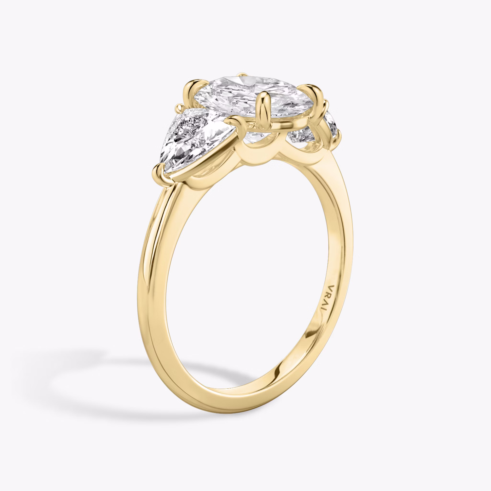 The Three Stone | Oval | 18k | Yellow Gold | bandAccent: Plain | sideStoneCarat: 0.50ct | sideStoneShape: Trillion | diamondOrientation: vertical | caratWeight: other
