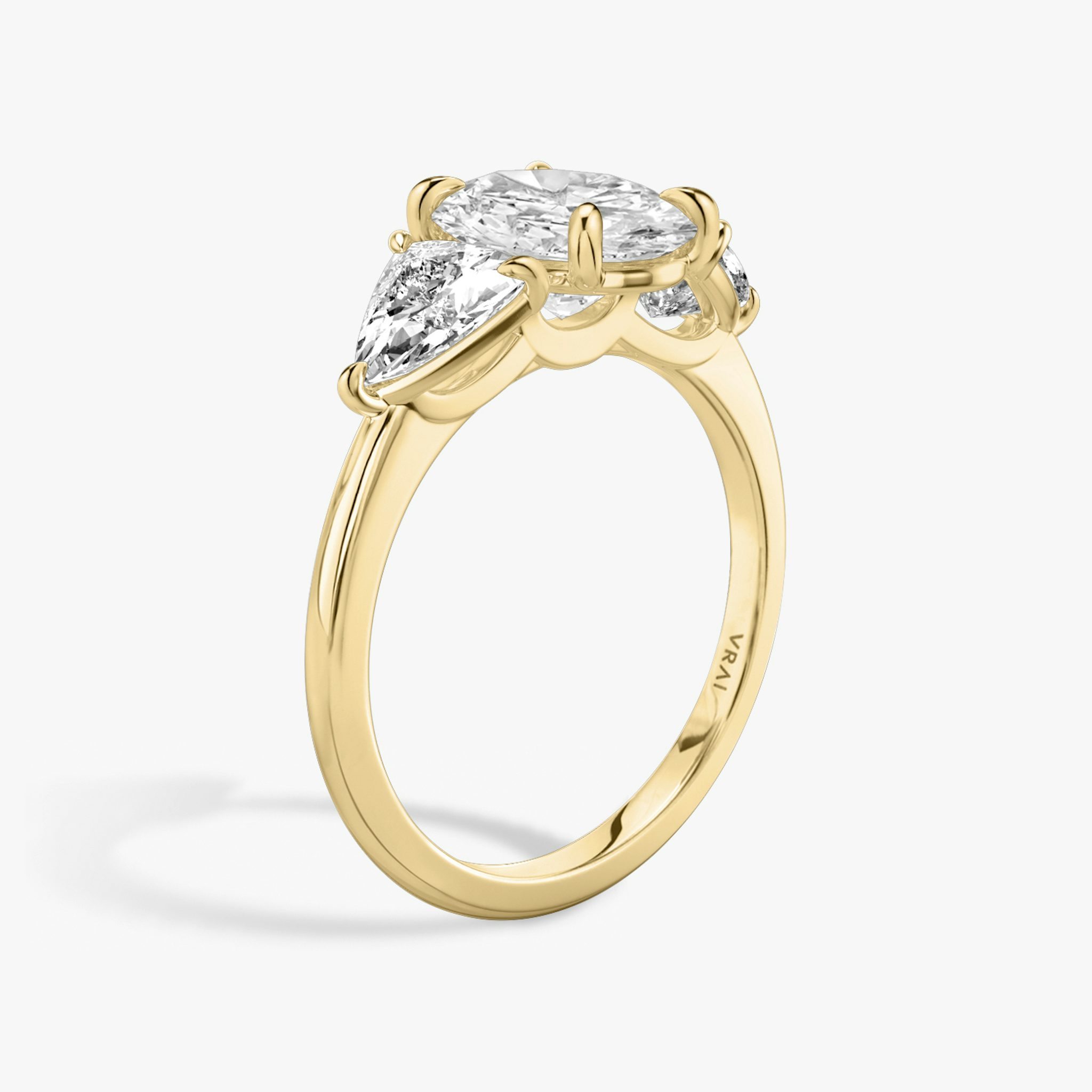 The Three Stone | Oval | 18k | Yellow Gold | bandAccent: Plain | sideStoneCarat: 0.50ct | sideStoneShape: Trillion | diamondOrientation: vertical | caratWeight: other