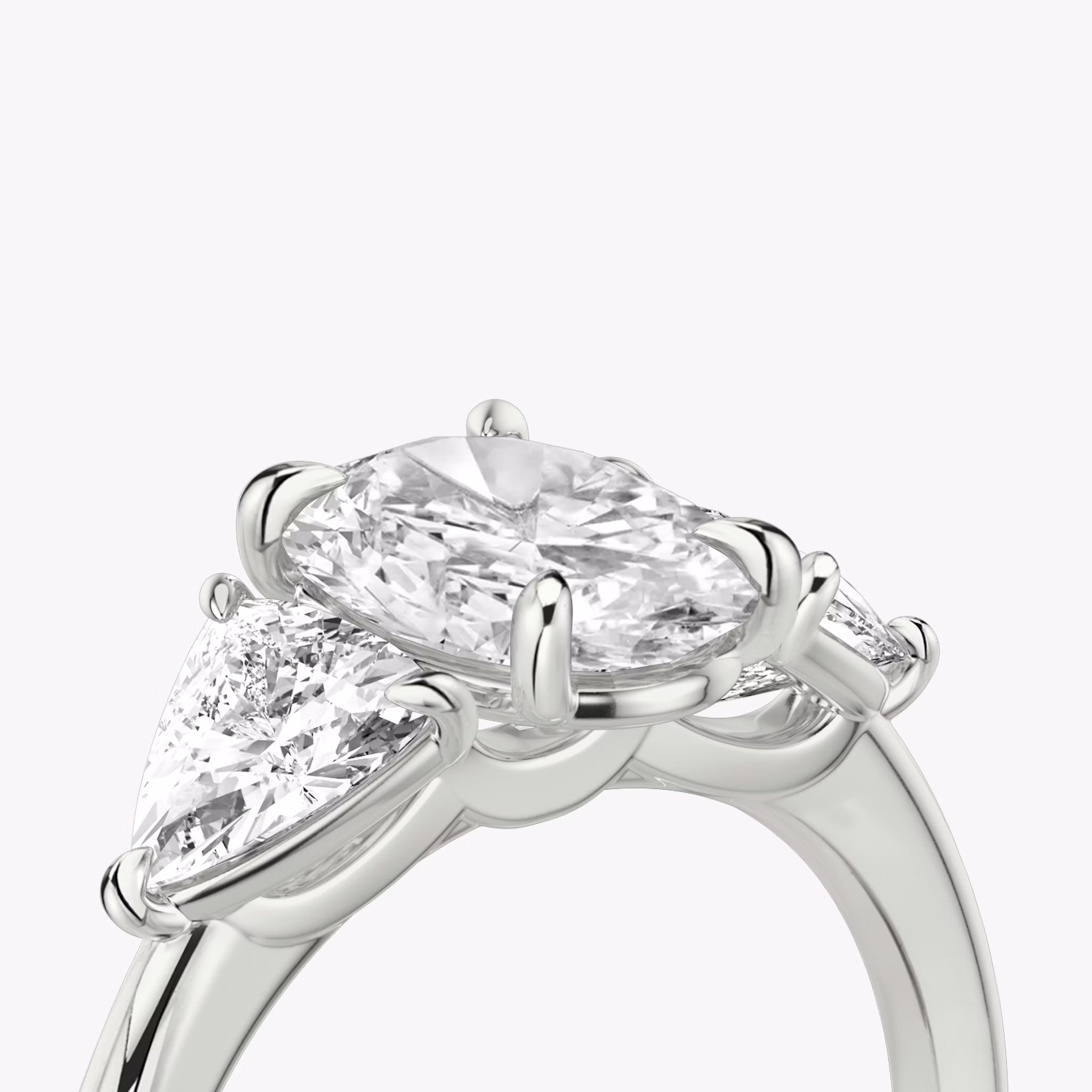 The Three Stone | Oval | 18k | White Gold | bandAccent: Plain | sideStoneCarat: 0.50ct | sideStoneShape: Trillion | diamondOrientation: vertical | caratWeight: other