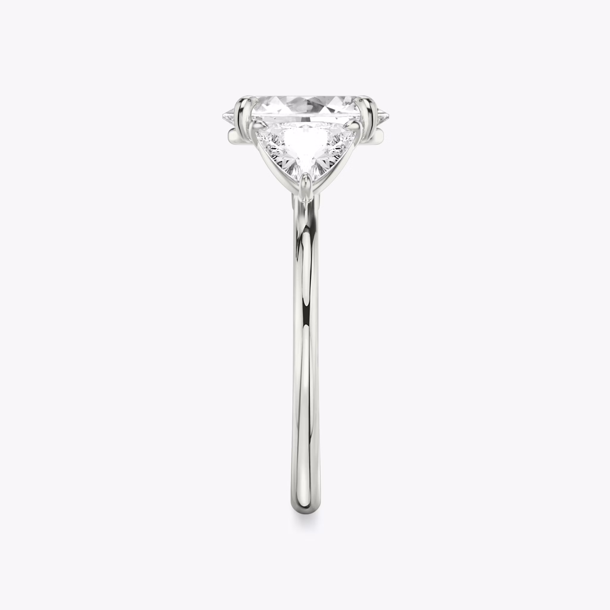 The Three Stone | Oval | 18k | White Gold | bandAccent: Plain | sideStoneCarat: 0.50ct | sideStoneShape: Trillion | diamondOrientation: vertical | caratWeight: other